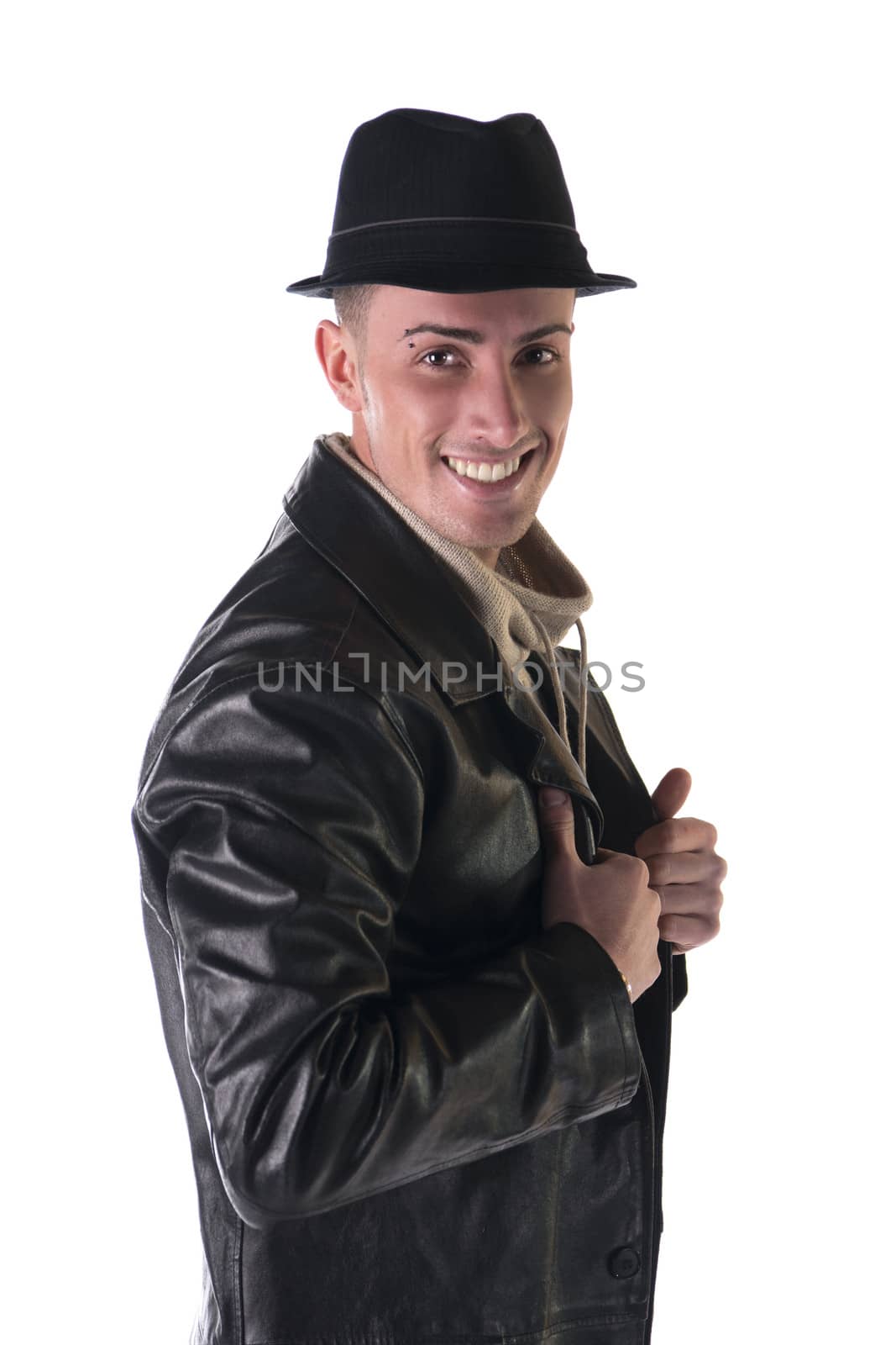 Smiling young man with black fedora hat and leather coat, isolated on white
