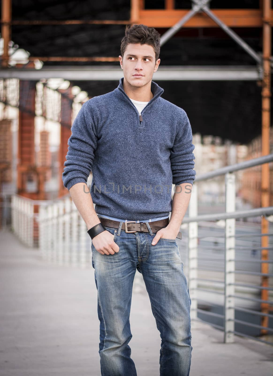 Handsome young man in industrial environment by artofphoto