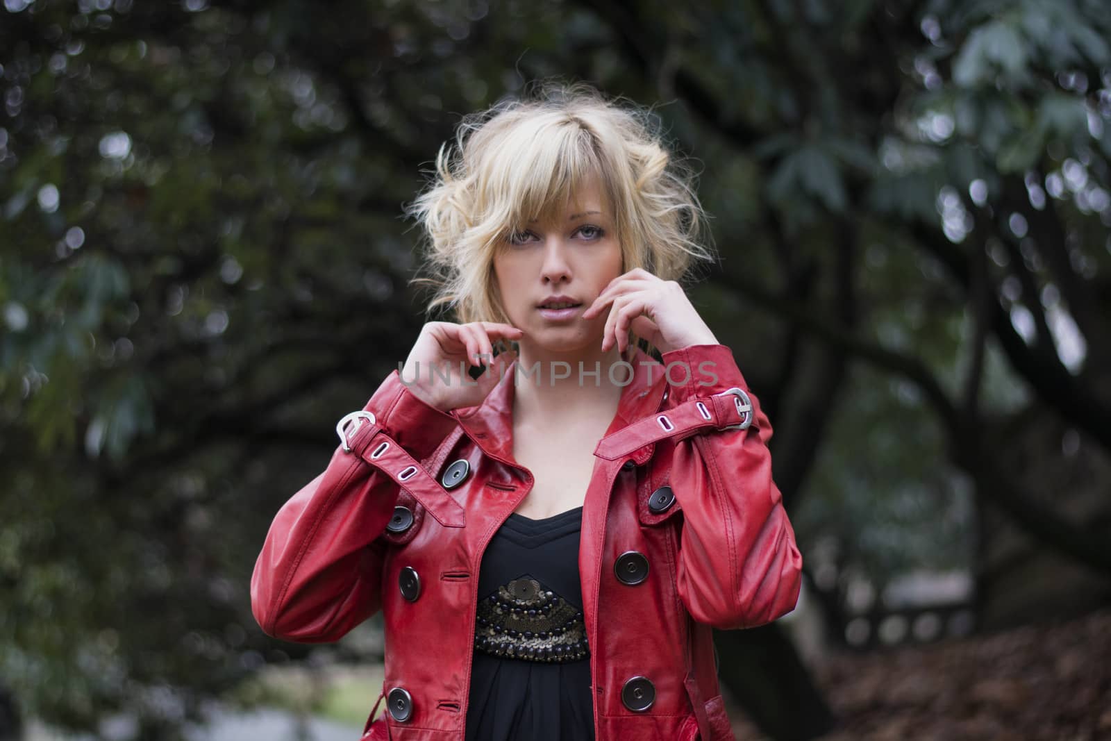 Attractive young woman with red leather jacket by artofphoto