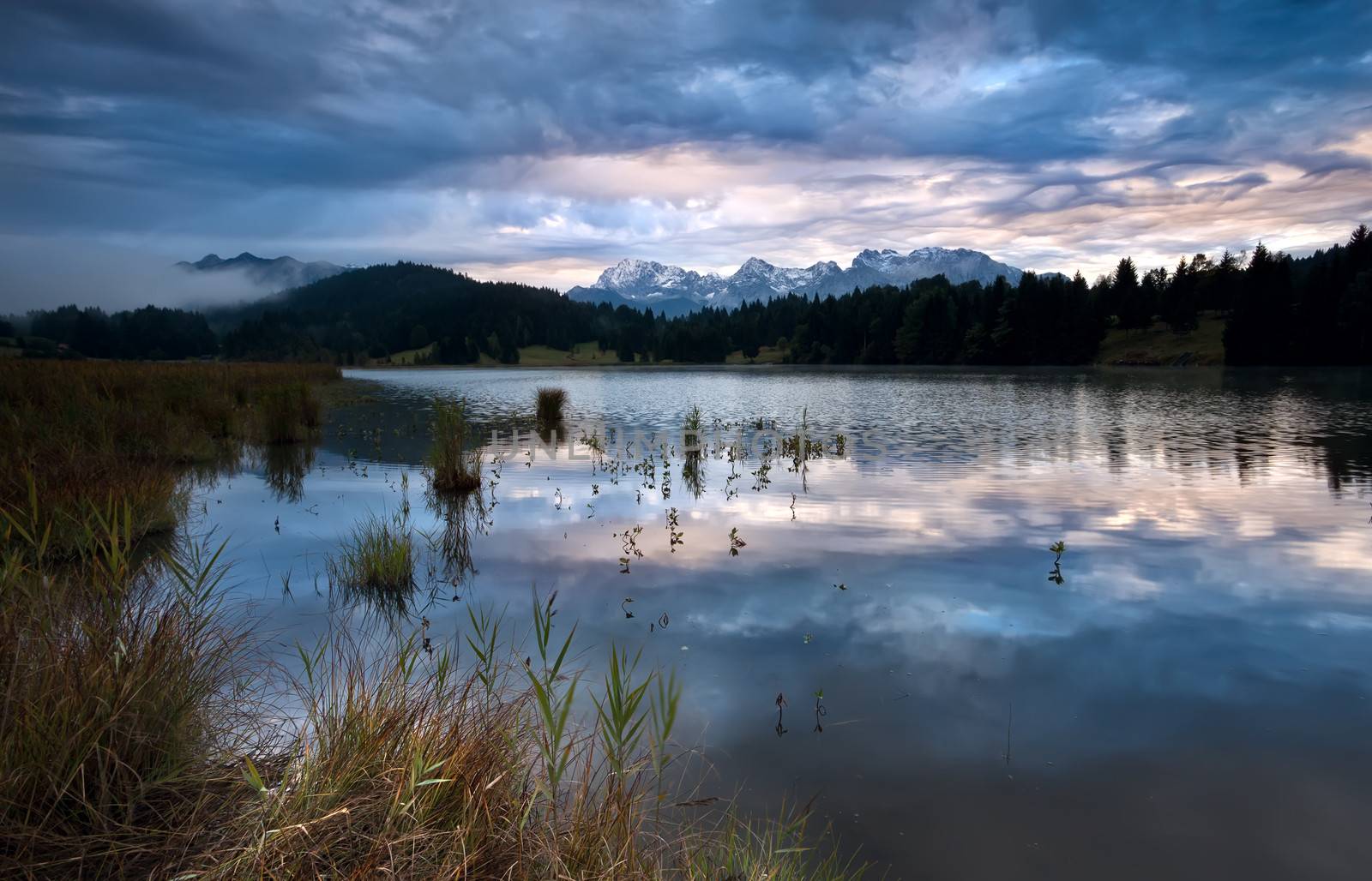 clouded sunrise over Geroldsee in Bavarian Alps, Germany