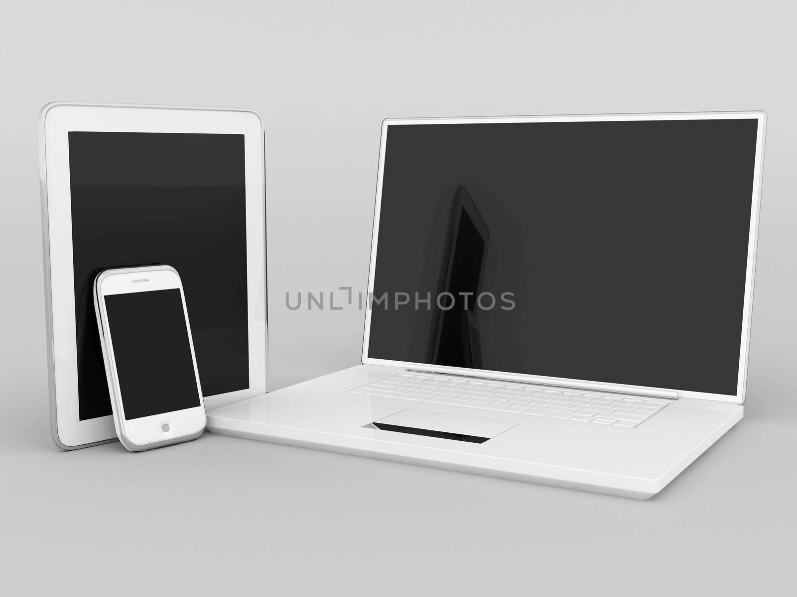 Laptop, tablet and smartphone on a gray background