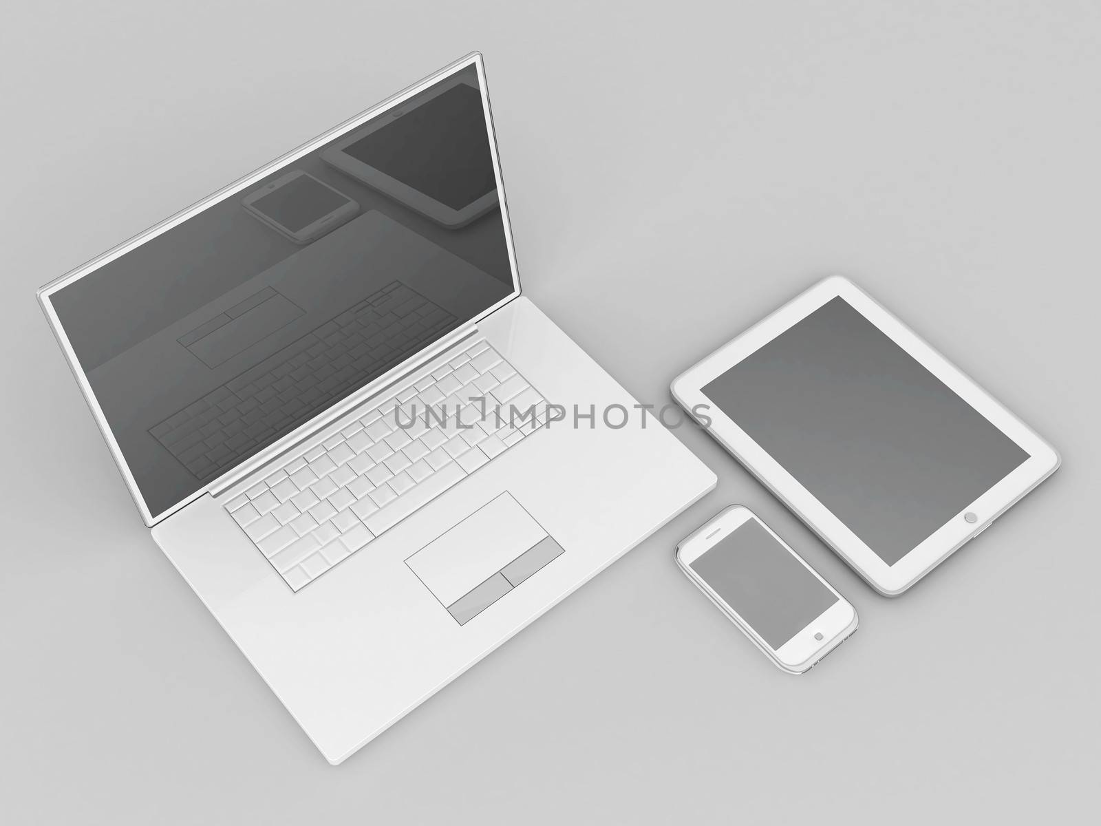 Laptop, tablet and smartphone on a gray background