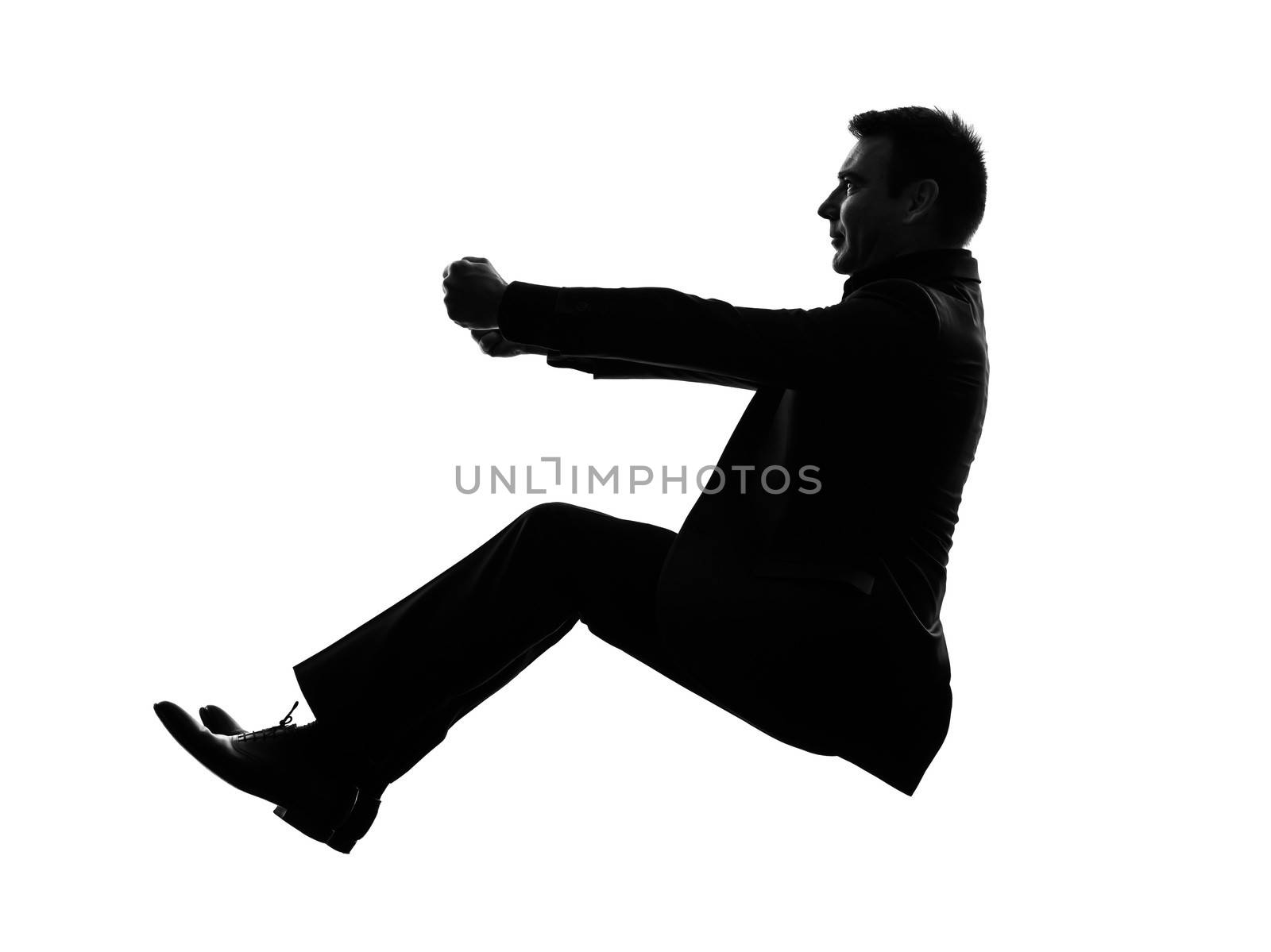 one caucasian business man driving in silhouette  on white background