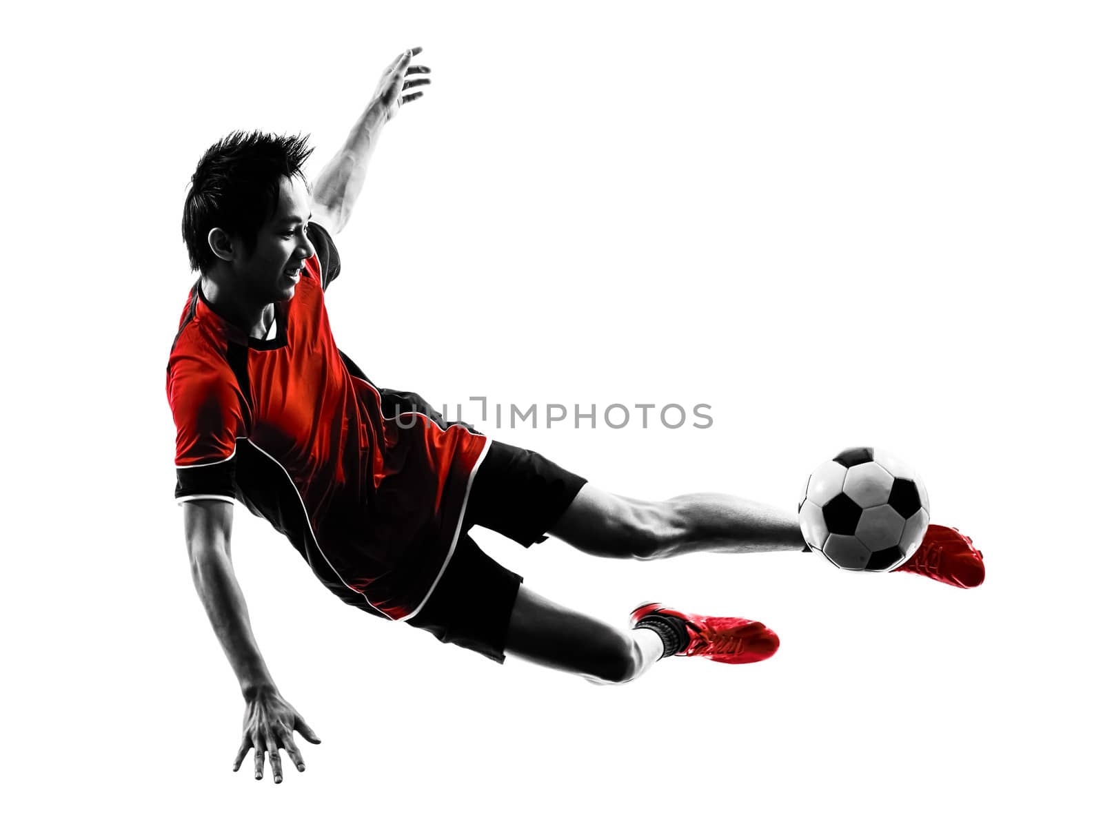 one asian soccer player young man kicking in silhouette isolated white background