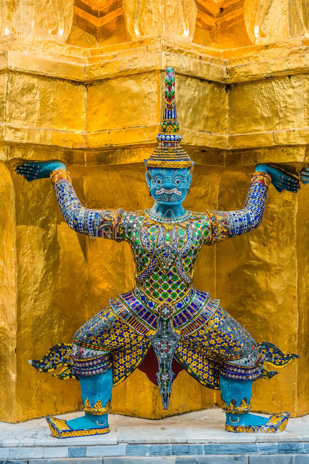 yaksha demon supporting golden chedi grand palace bangkok thailand