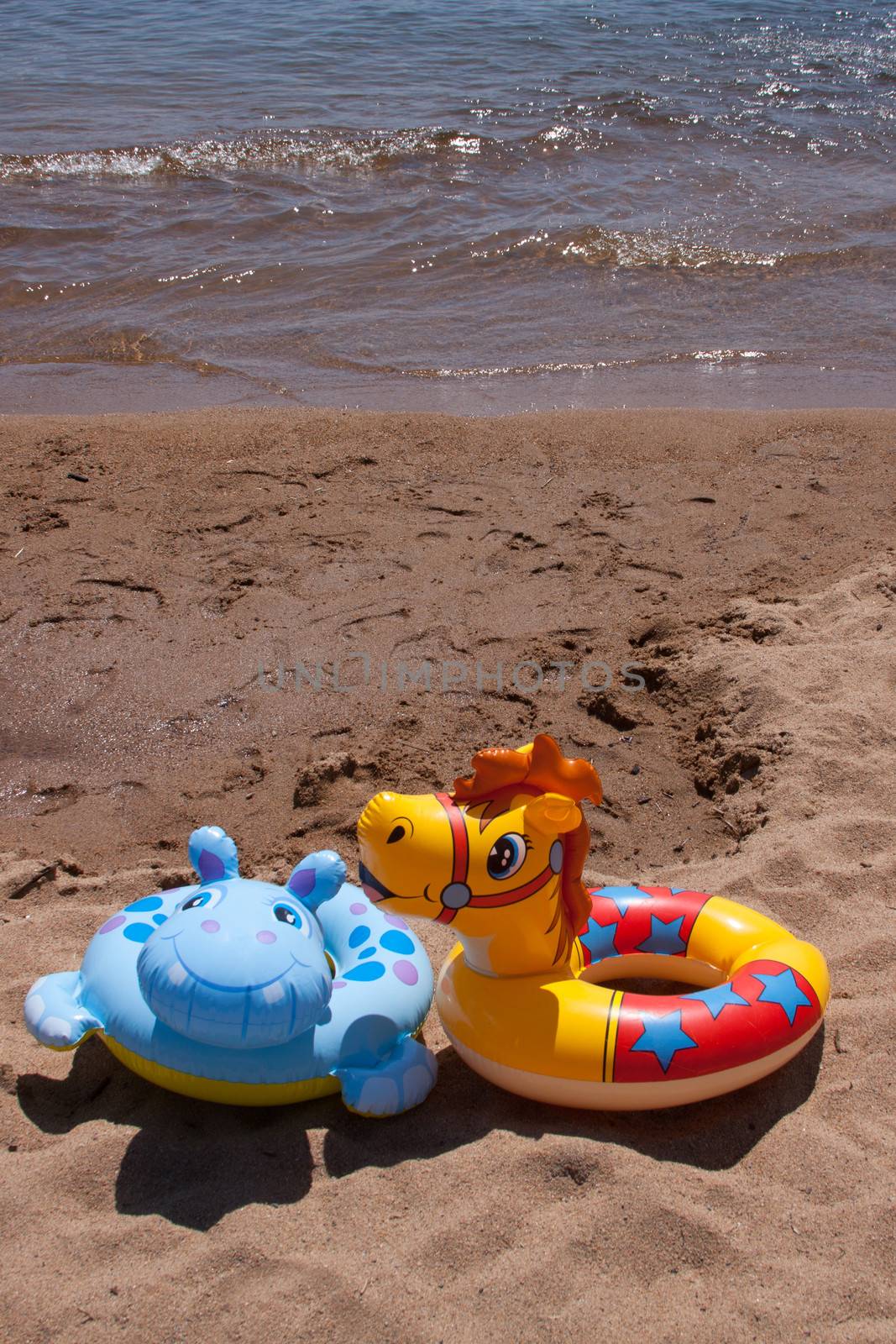 Children's floating toys on the beach.