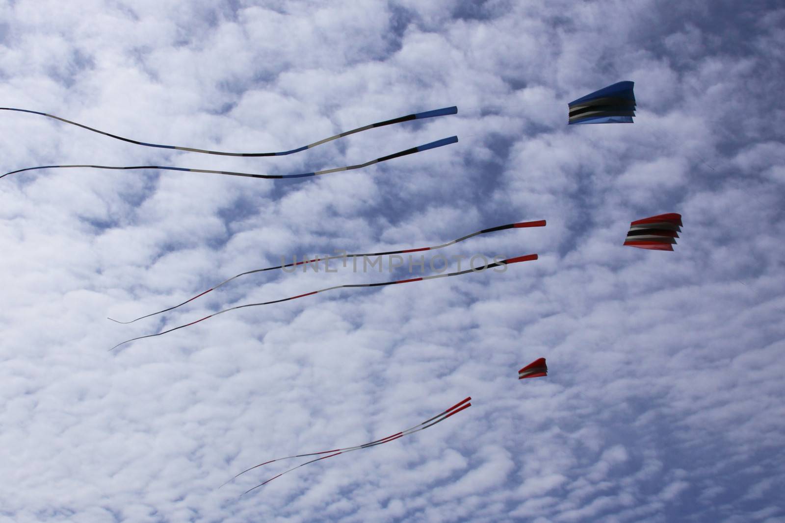 Kites against a blue sky.