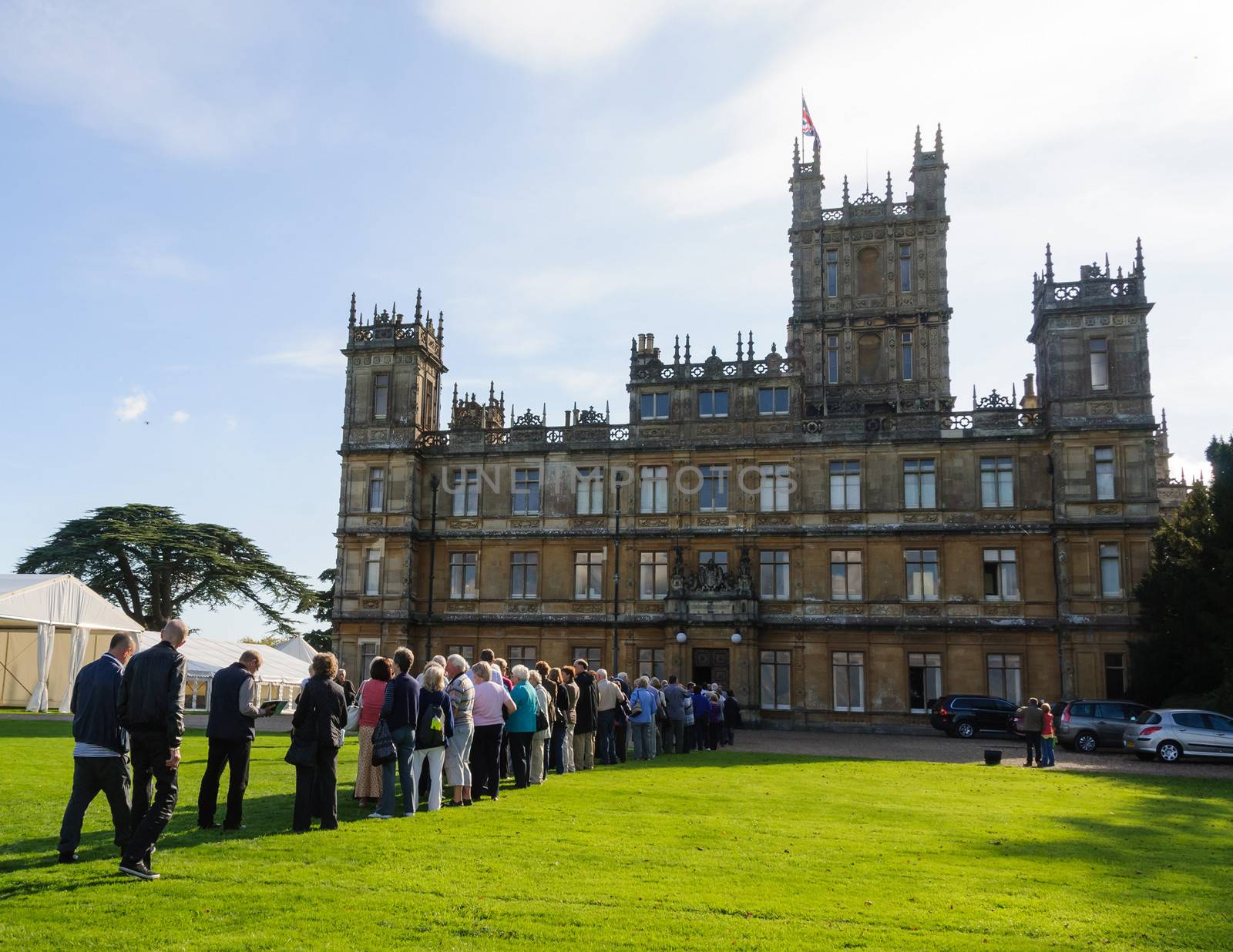 NEWBURY, UK - CIRCA OCTOBER 2011: People  queuing to visit Highclere Castle which  is the main setting for the ITV period drama Downton Abbey.