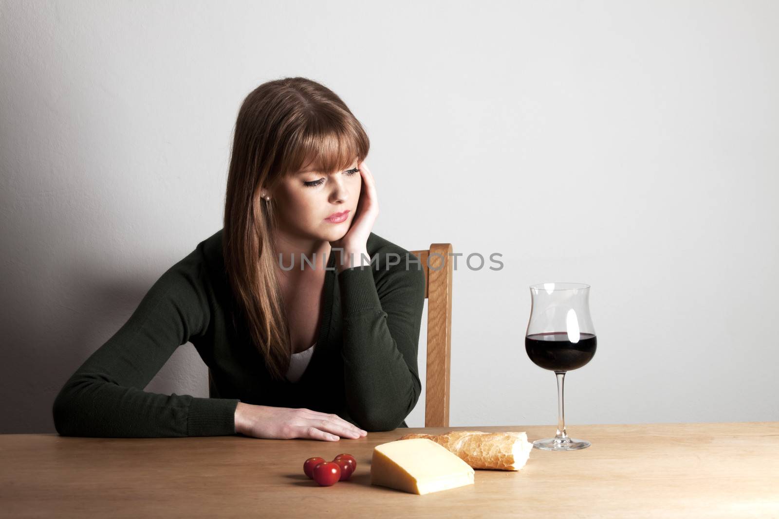 young woman and a glass of wine