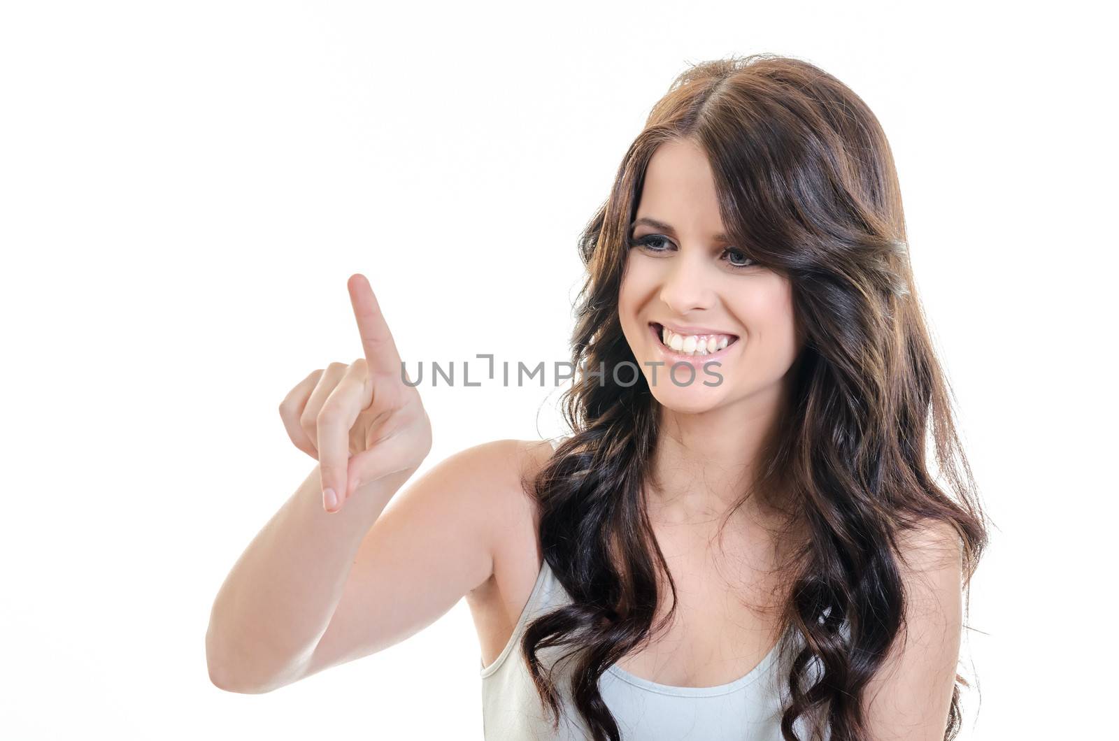 Happy Young Brunette Woman Touching Imaginary Screen with Her Finger - over white