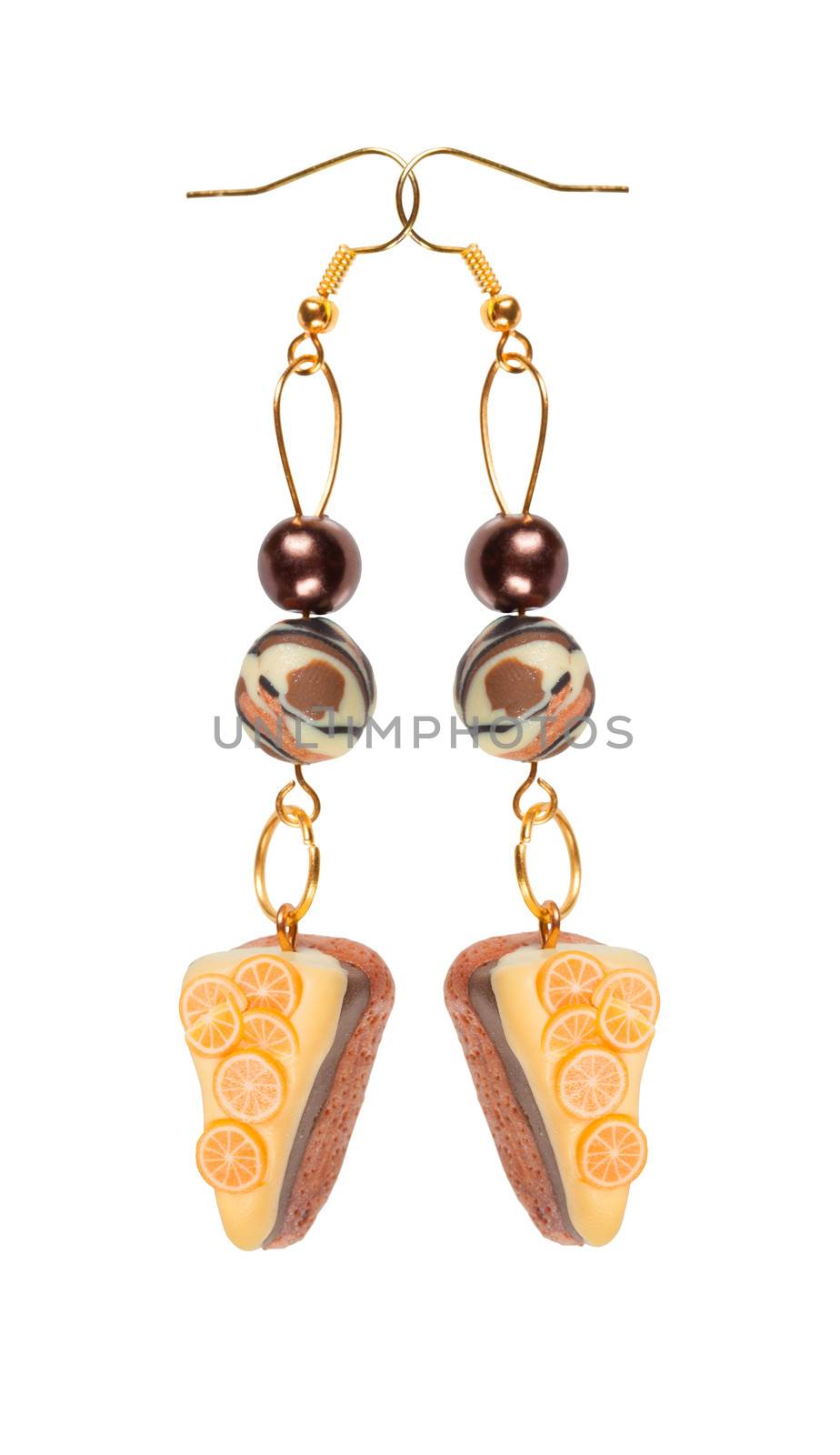 Earrings made of plastic in the form of the cake with lemon Isolated on white background.