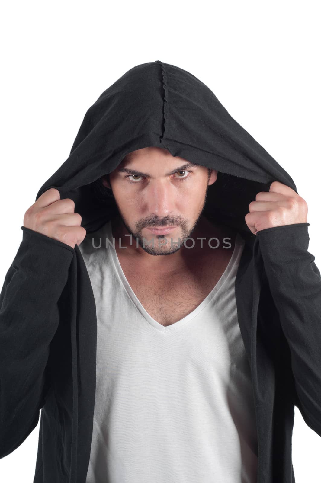 A man in a hood looks askance menacingly