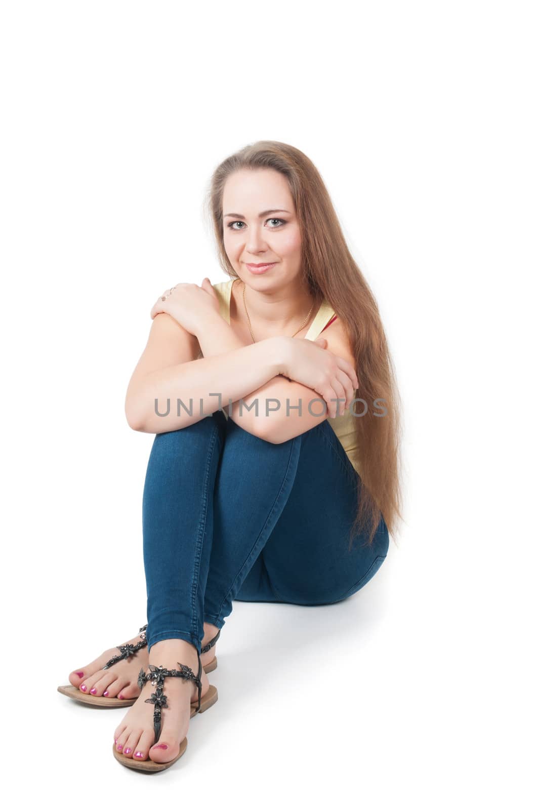 Positive young female sitting on the floor by anytka