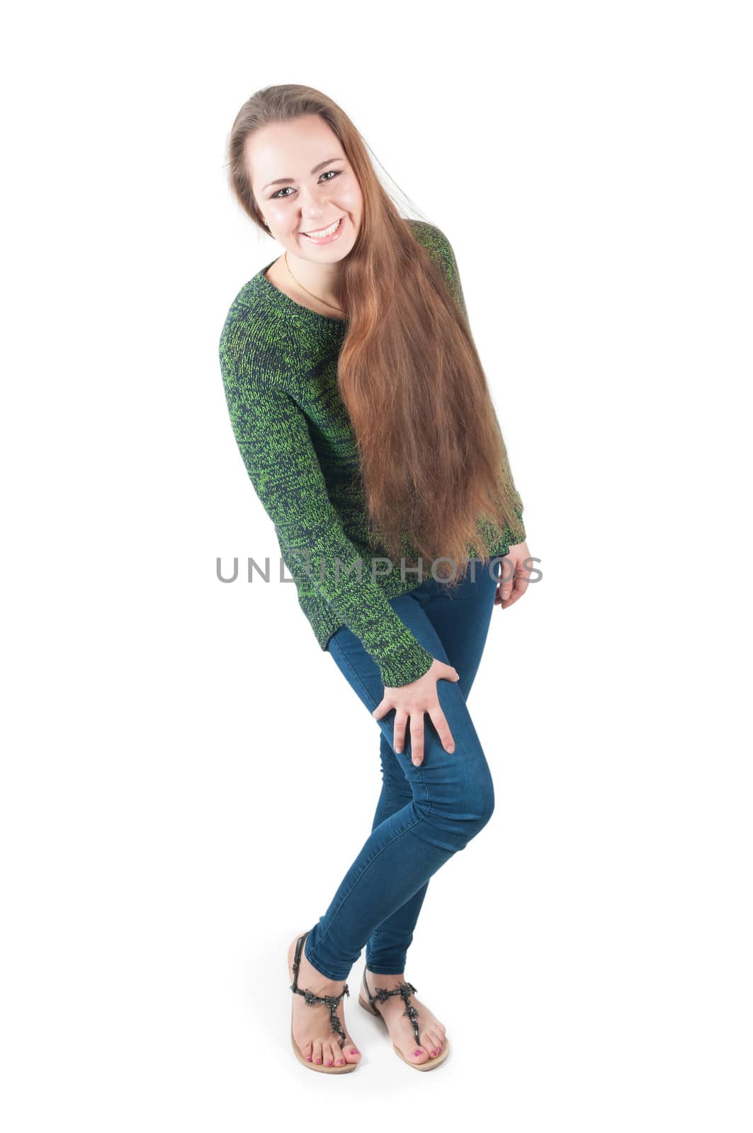 Happy young female in sweater and jeans, isolated