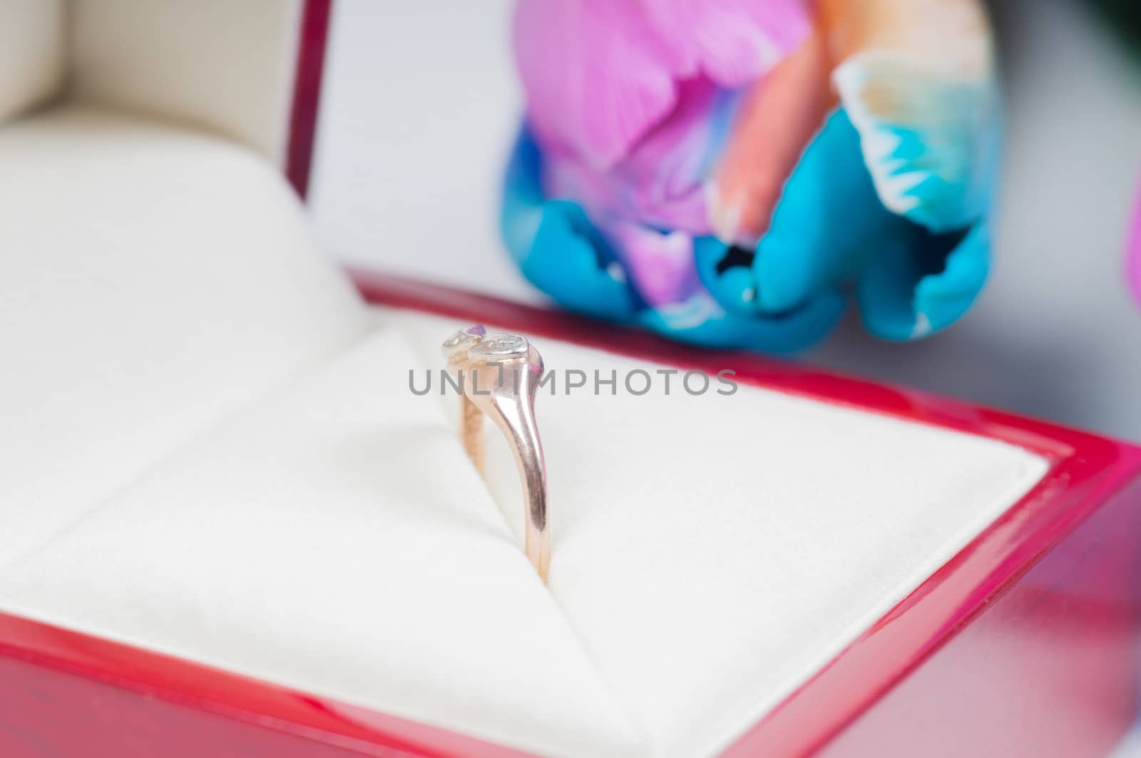 Unusual multi colored tulips and ring in red box