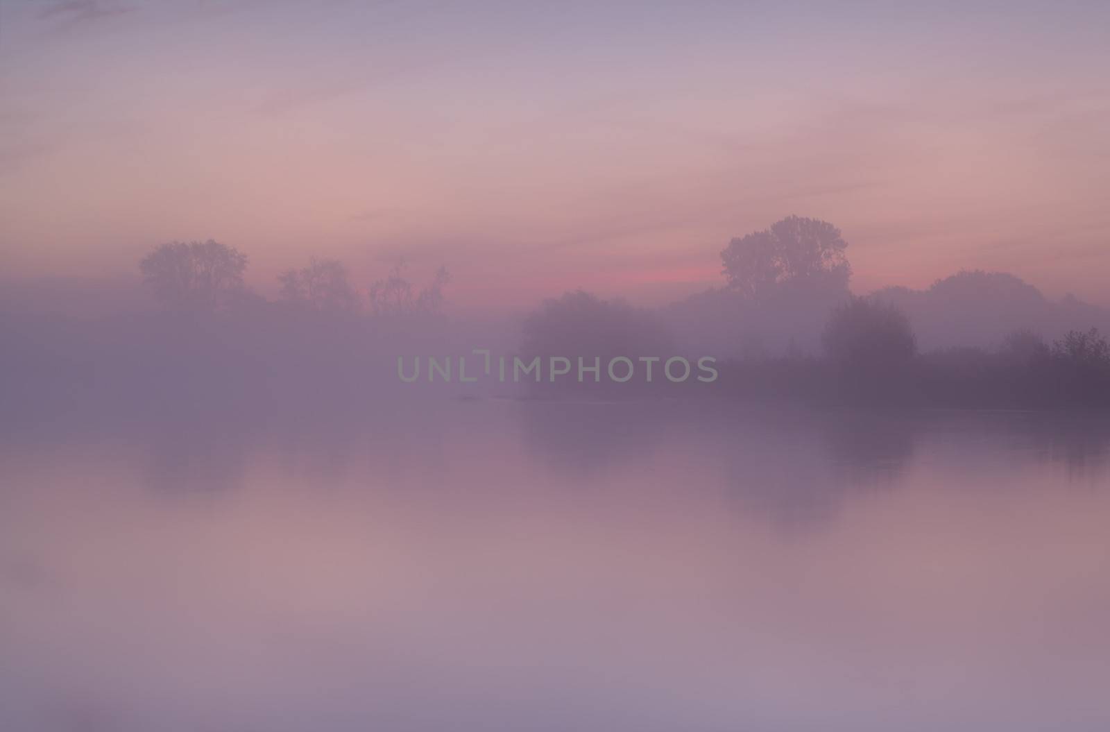 tranquil misty sunrise over river Drentsche Aa, Drenthe, Netherlands