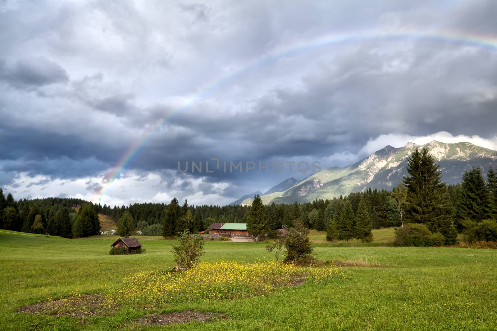 rainbow after rain in Alps by catolla