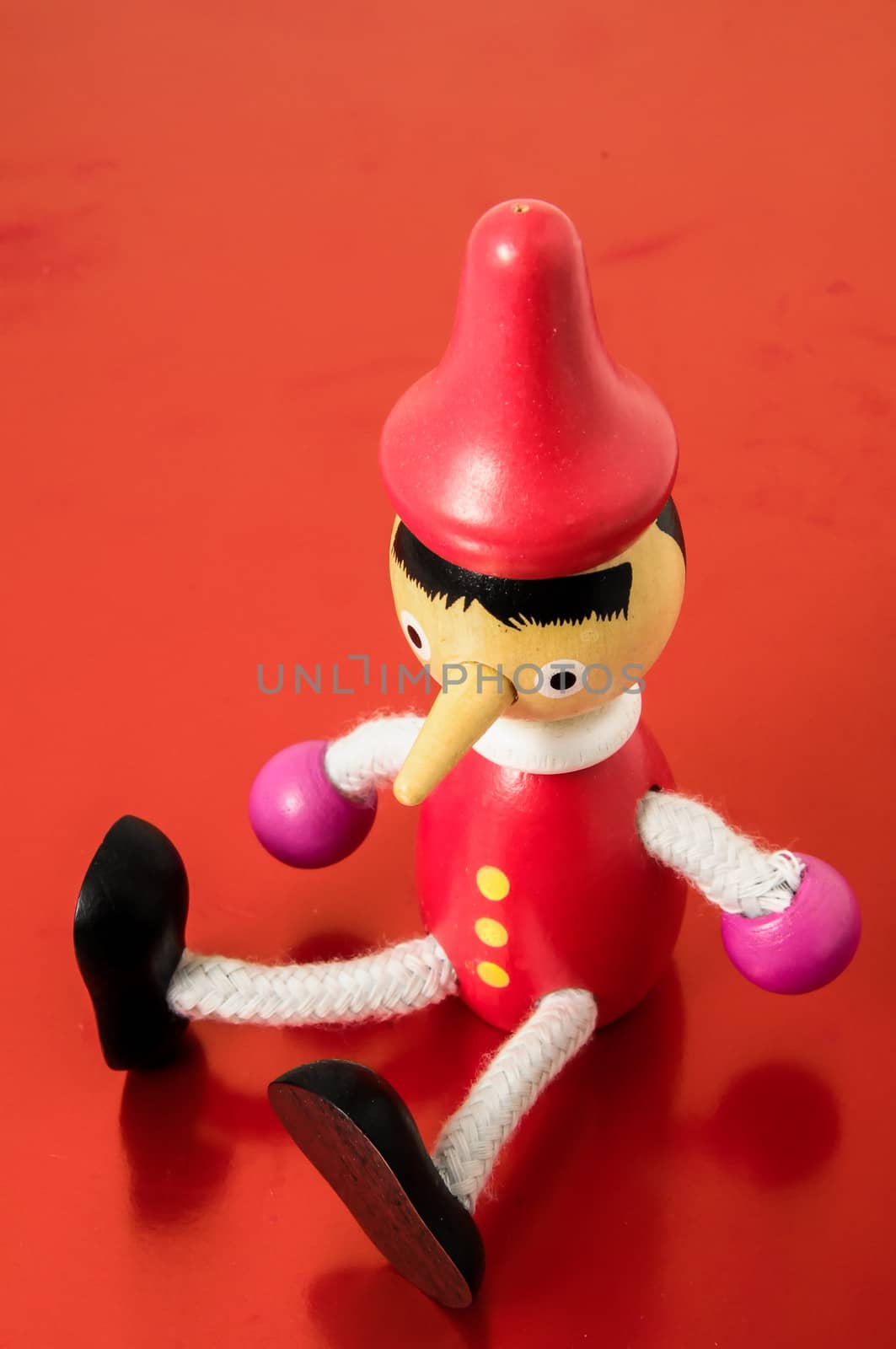 Pinocchio Toy Statue on a Colored Background