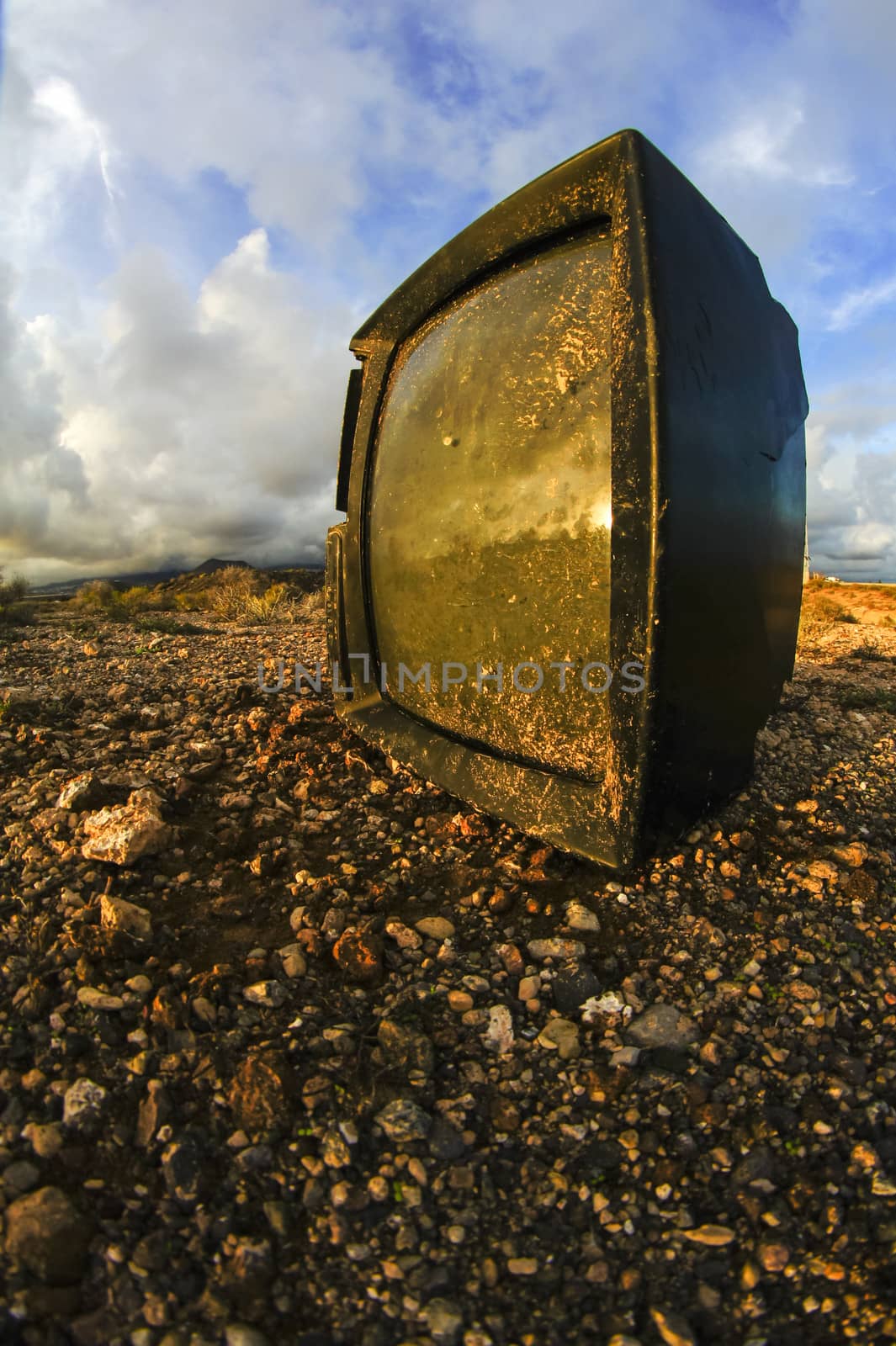 Abandoned Broken Television in the Desert on a Cloudy Day