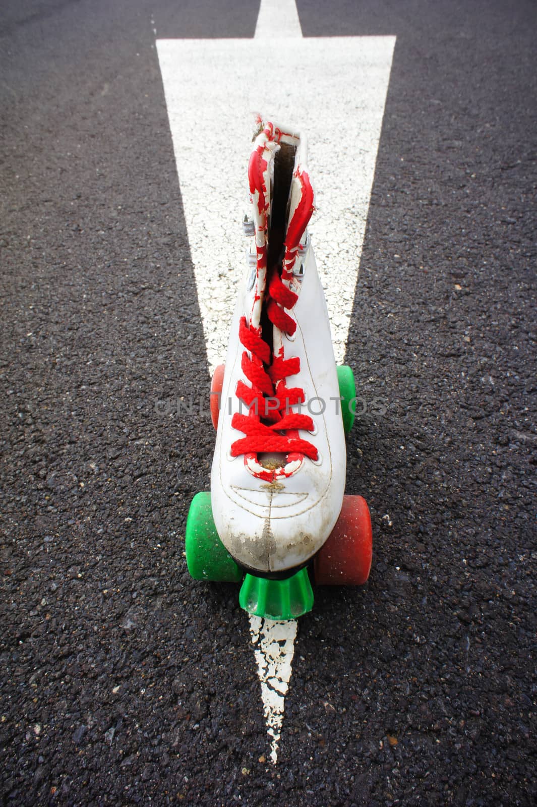 Old Vintage White Skate Boot on the Asphalt Sterret