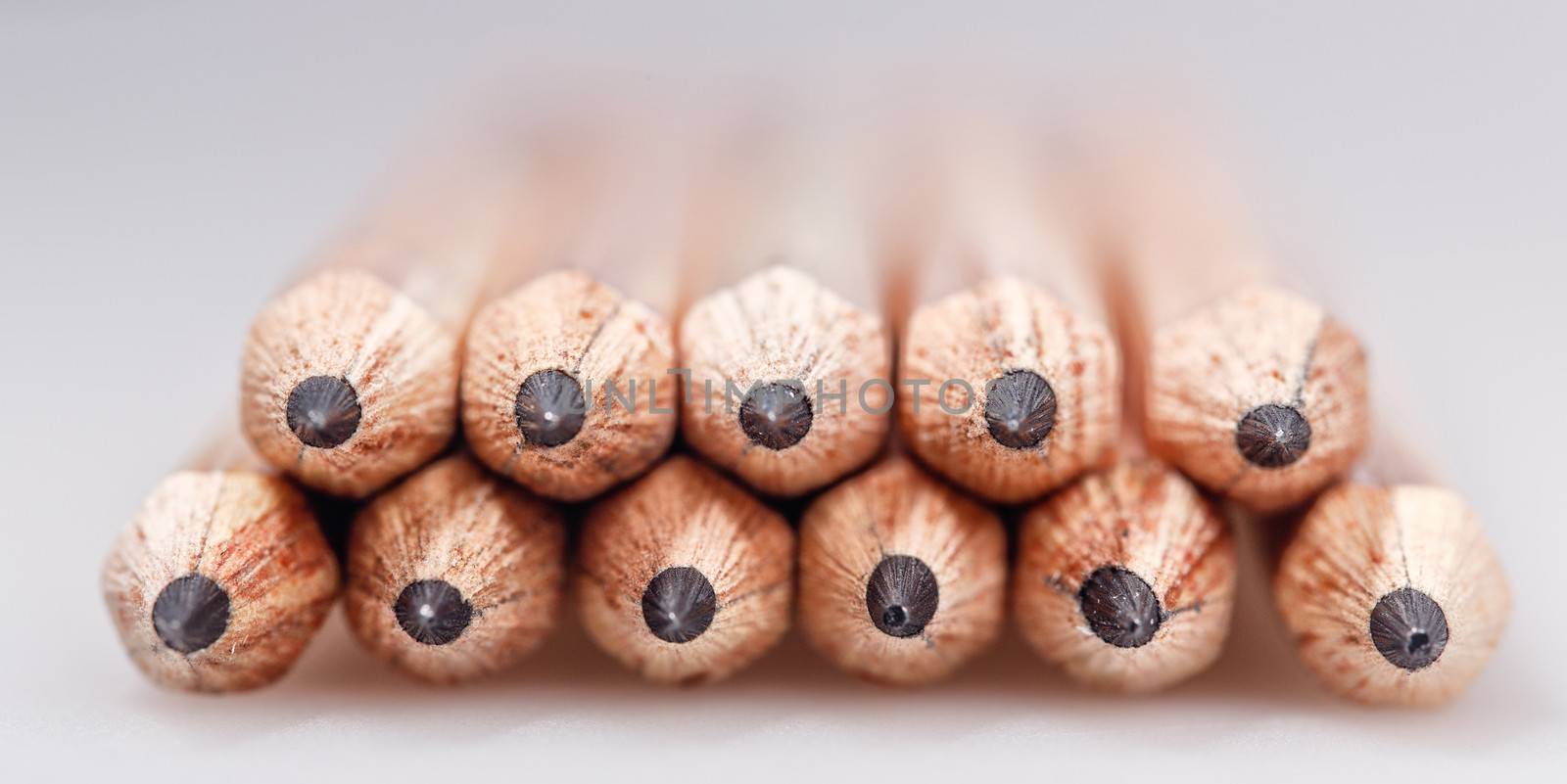 Graphite wooden pencils for sketching shot closeup background