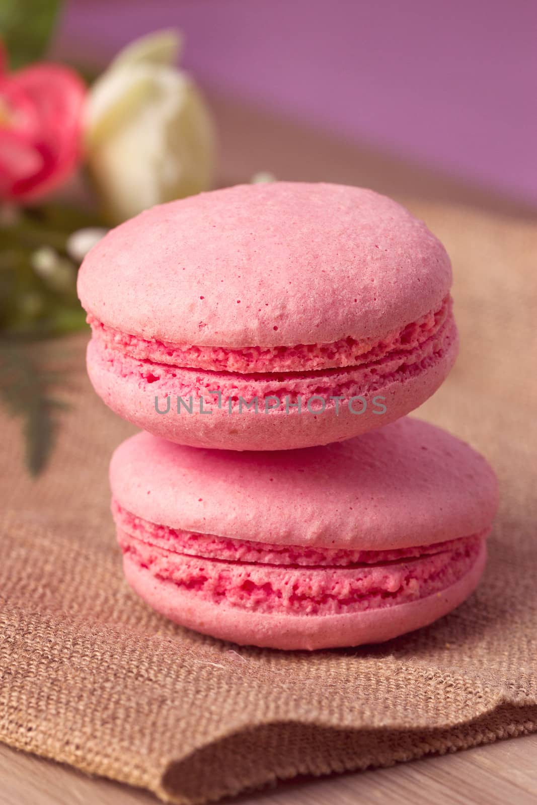 Pink macaroon with raspberry flavor on sacking