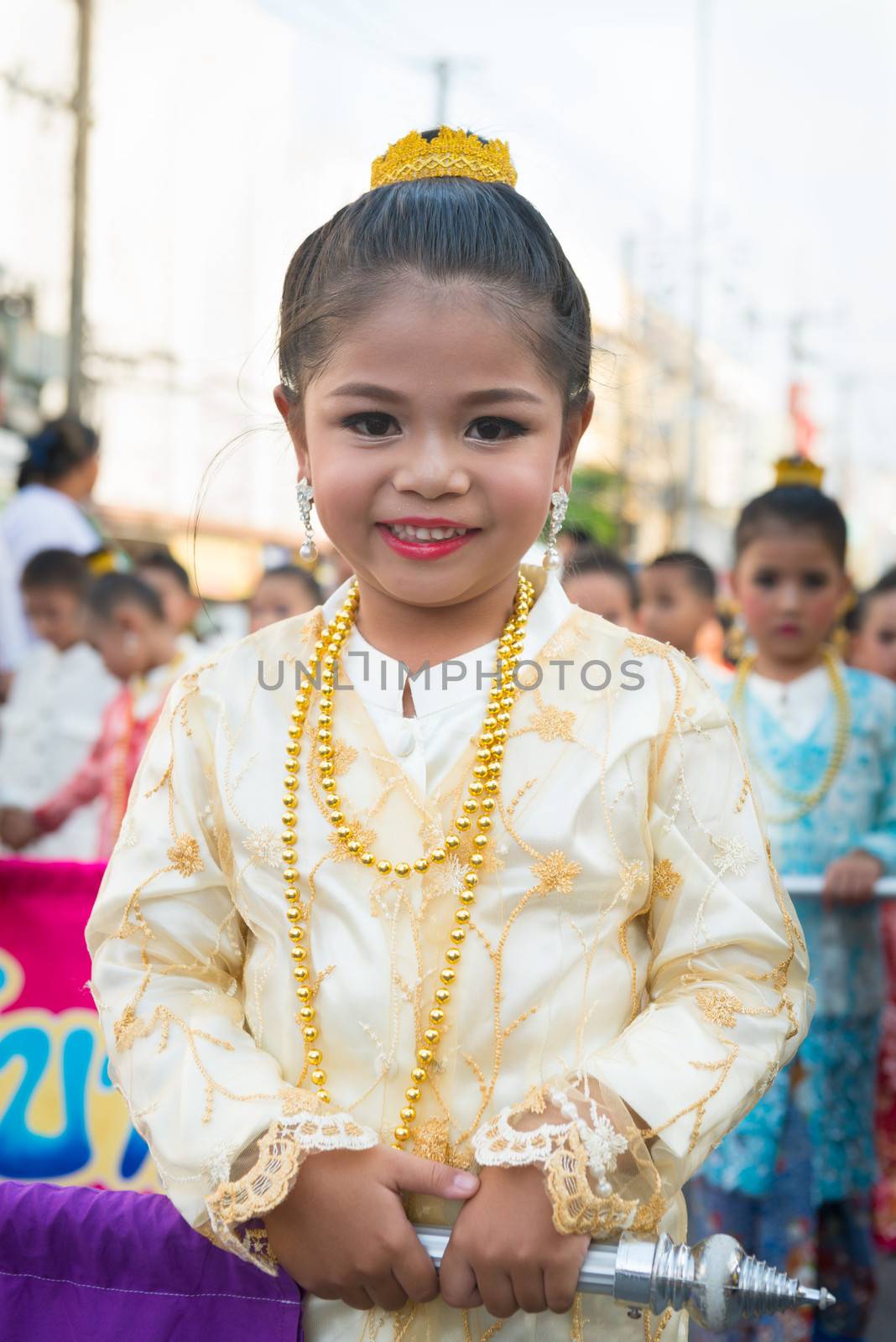 PHUKET, THAILAND - 07 FEB 2014: Beautiful small girl take part in procession parade of annual old Phuket town festival. 