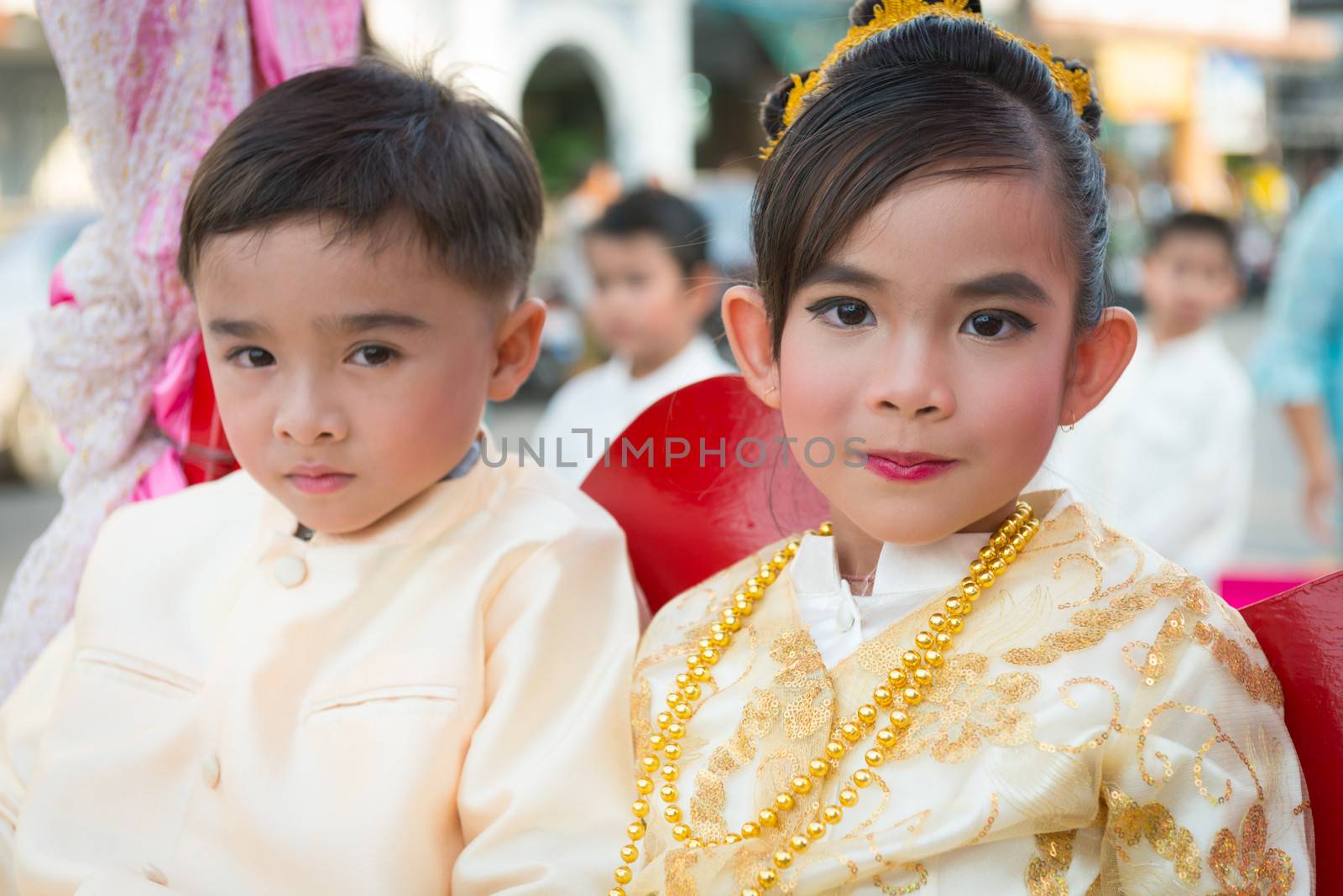 PHUKET, THAILAND - 07 FEB 2014: Small children take part in procession parade of annual old Phuket town festival. 