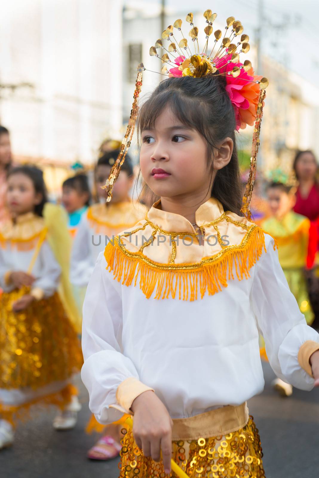 PHUKET, THAILAND - 07 FEB 2014: Young girl take part in procession parade of annual old Phuket town festival. 