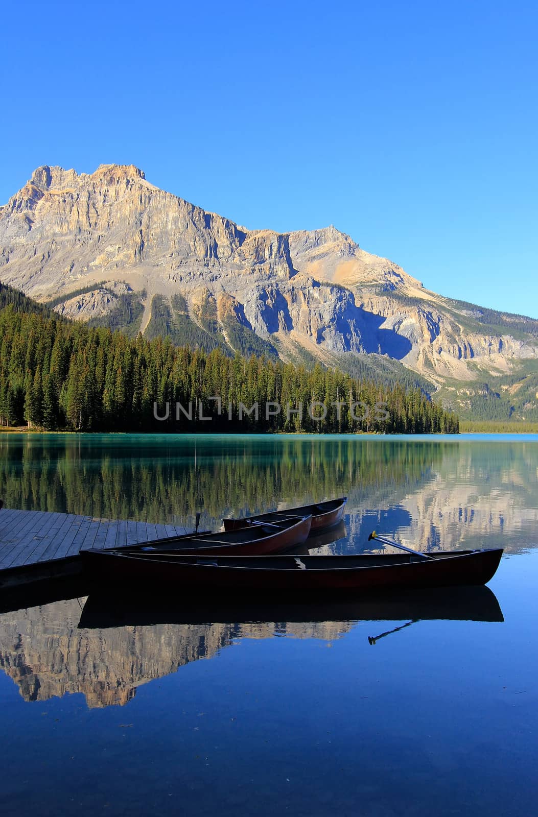 Mountains reflected in Emerald Lake, Yoho National Park, British Columbia, Canada