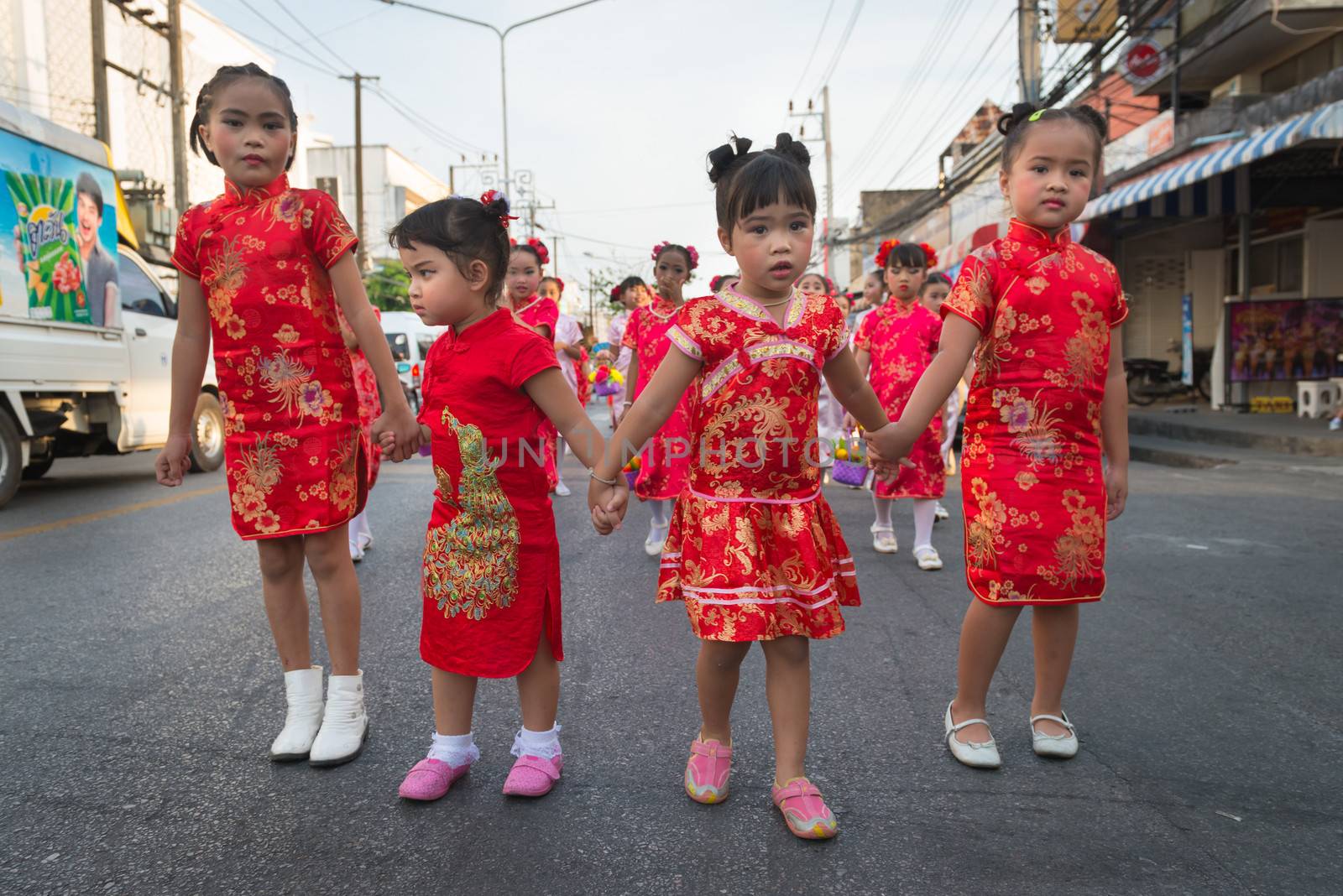 PHUKET, THAILAND - 07 FEB 2014: Small Phuket town residents take part in procession parade of annual old Phuket town festival. 