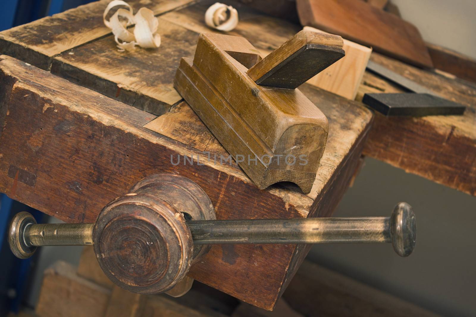 Old wooden vise and tool in a workshop. All wooden