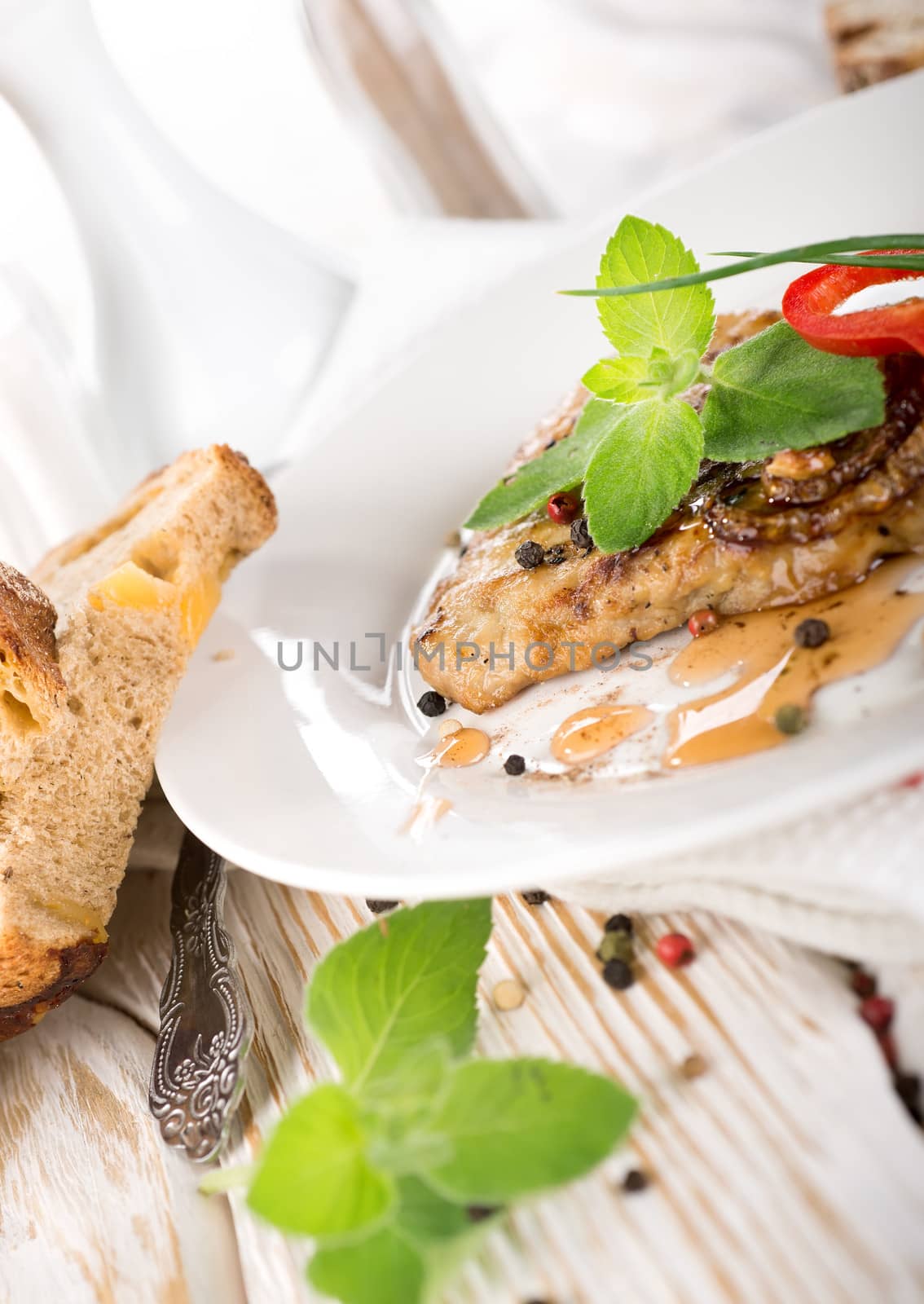 Delicious nourishing steak with vegetables, greens and bread