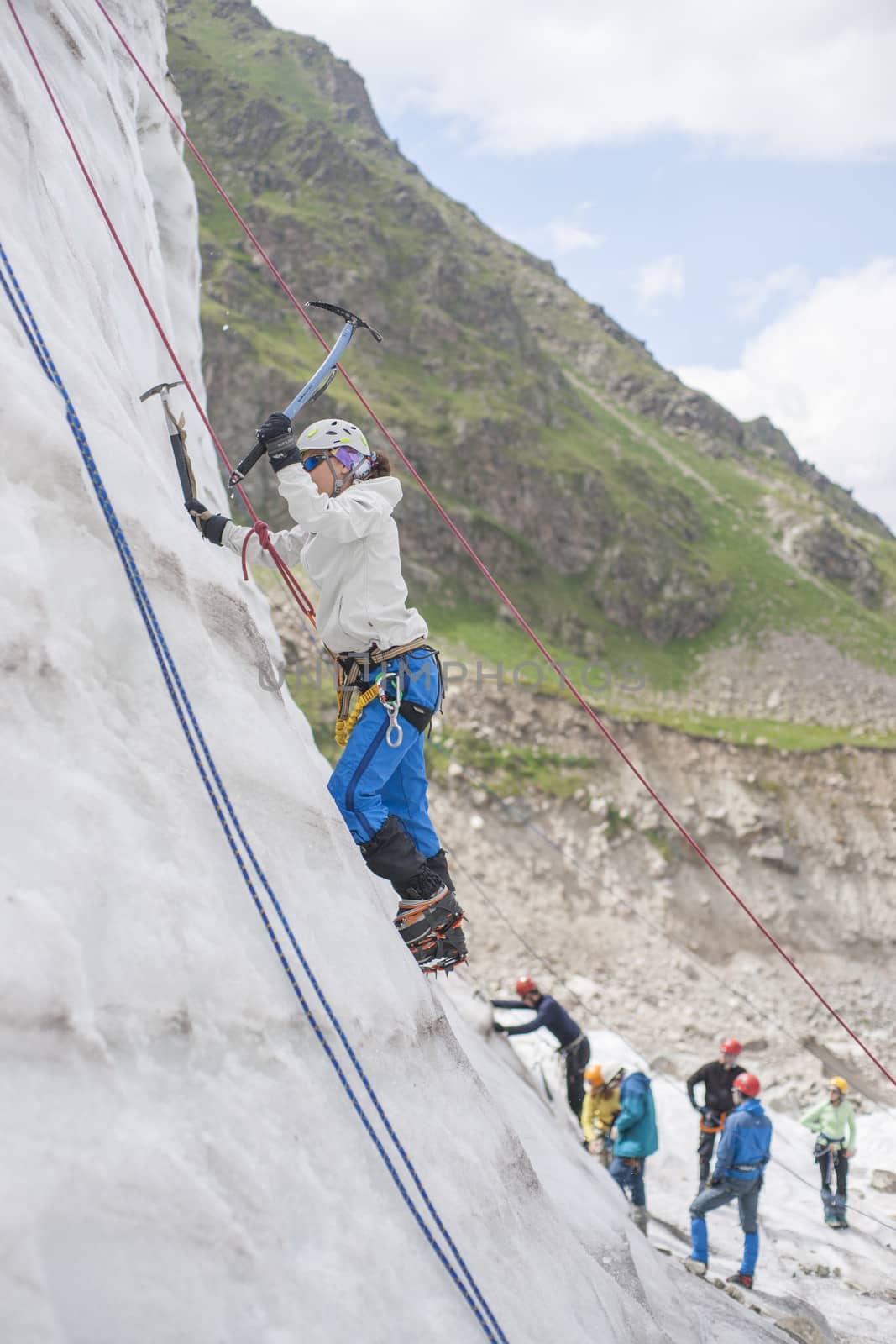 Girl climb up on the ice by kozak