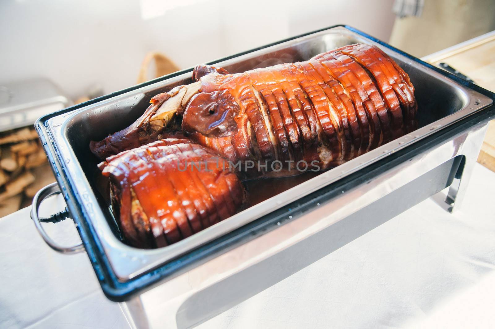 roast suckling pig in a silver tray