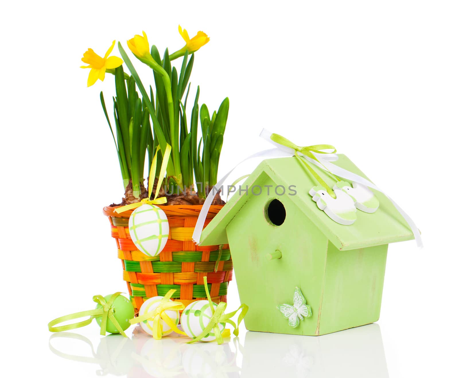 Easter eggs with birdhouse, on a white background