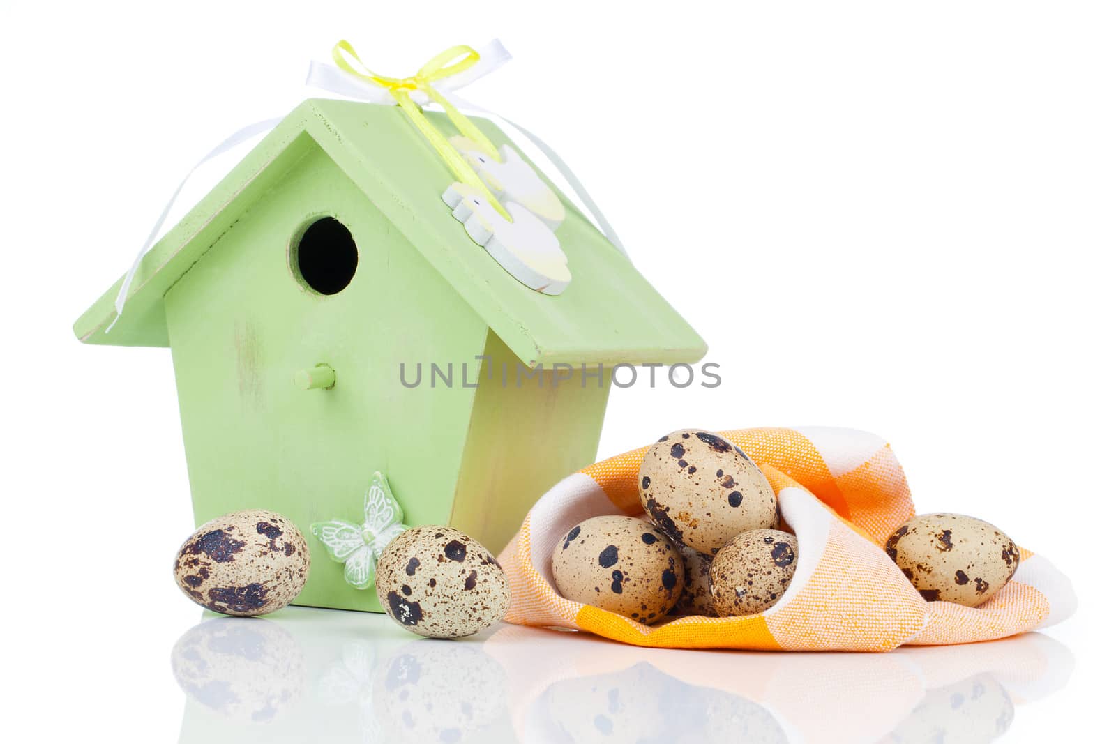 quail eggs with birdhouse, on a white background