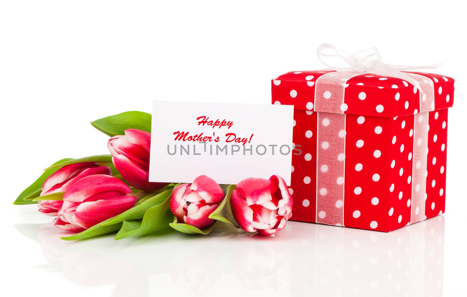 beautiful tulips with red polka-dot gift box. happy mothers day, romantic still life, fresh flowers