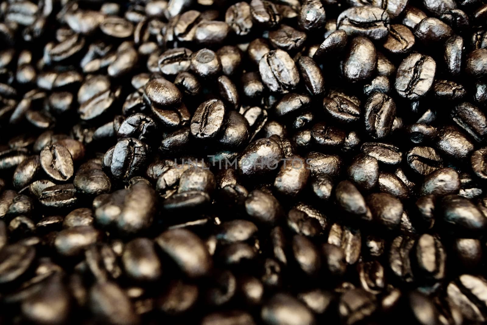 Black coffee beans placed on the background.