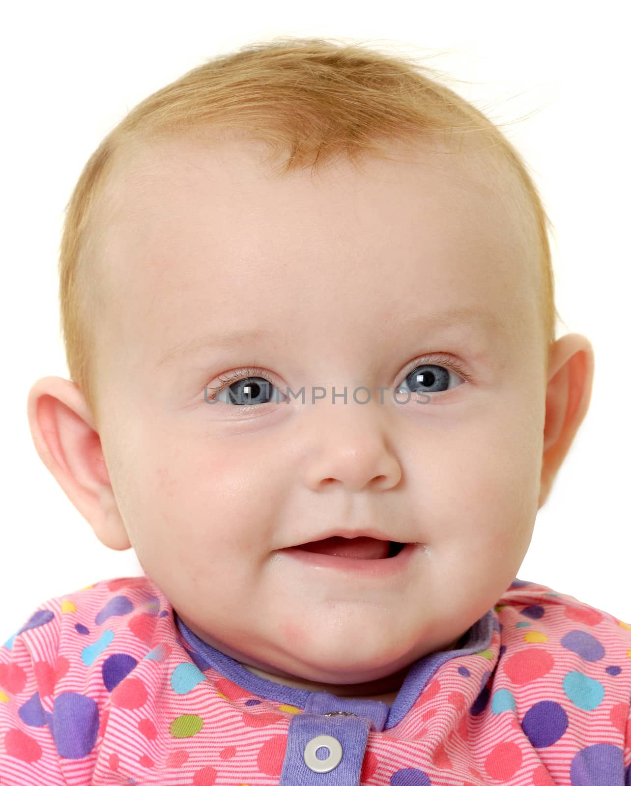 Face of a sweet happy baby 3 month young.Taken on a white background.