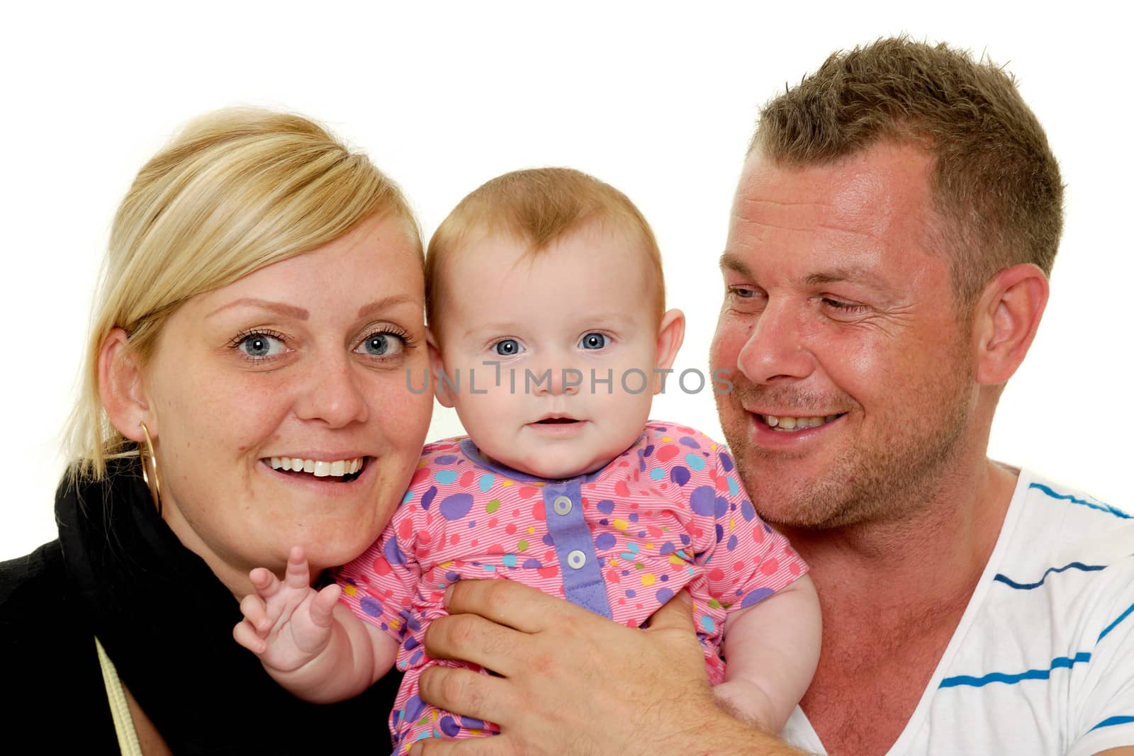 Happy family. Mother and father are looking at their sweet smiling 4 month old baby.