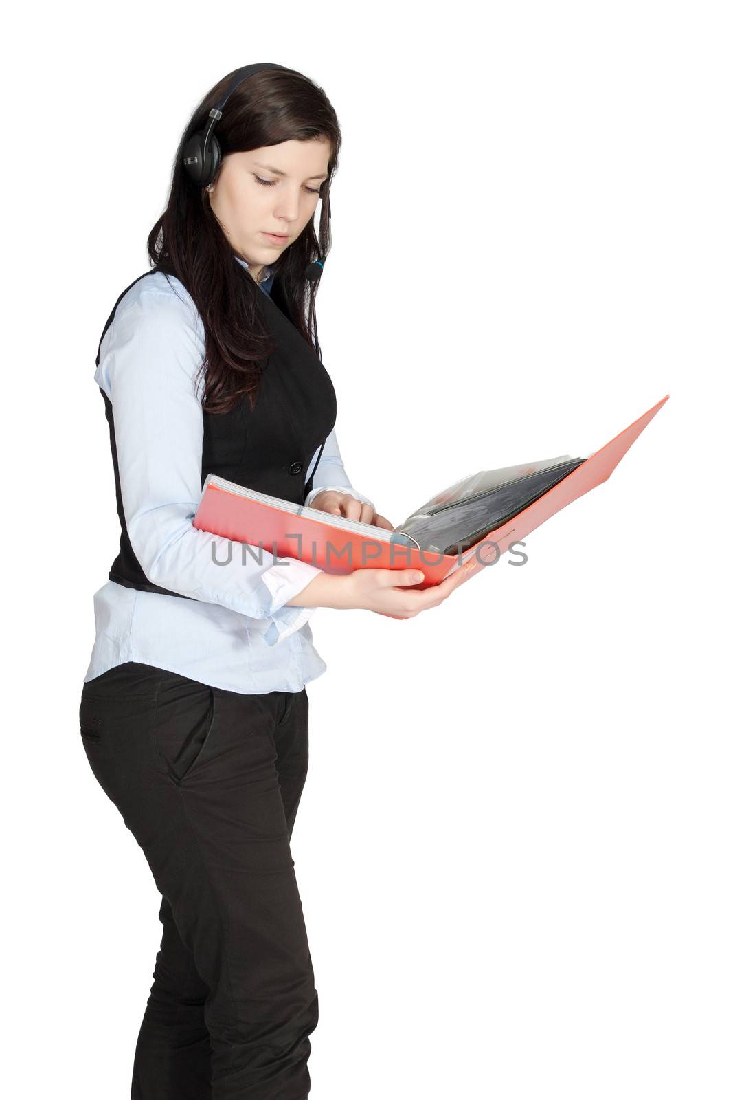 Young woman with headset phone while walking and holding hands a pile of documents, isolated on white background