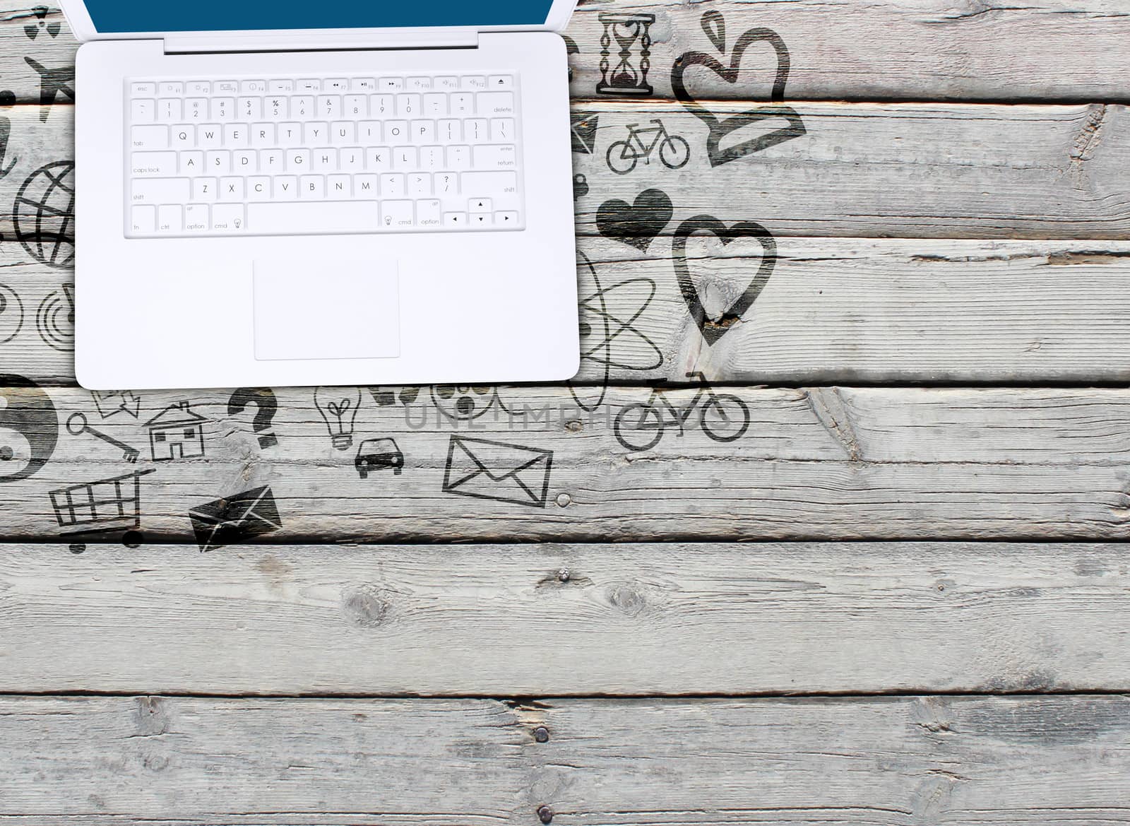 Laptop on an old wooden surface and social icons. Computer technology concept