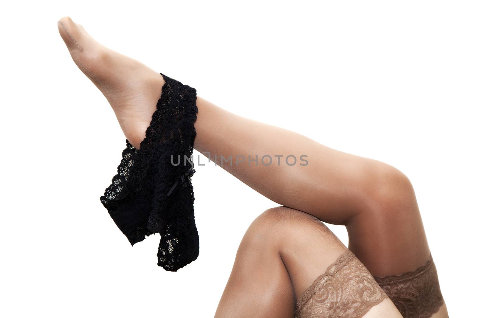 black panties hanging on a female leg in stocking by raddnatt