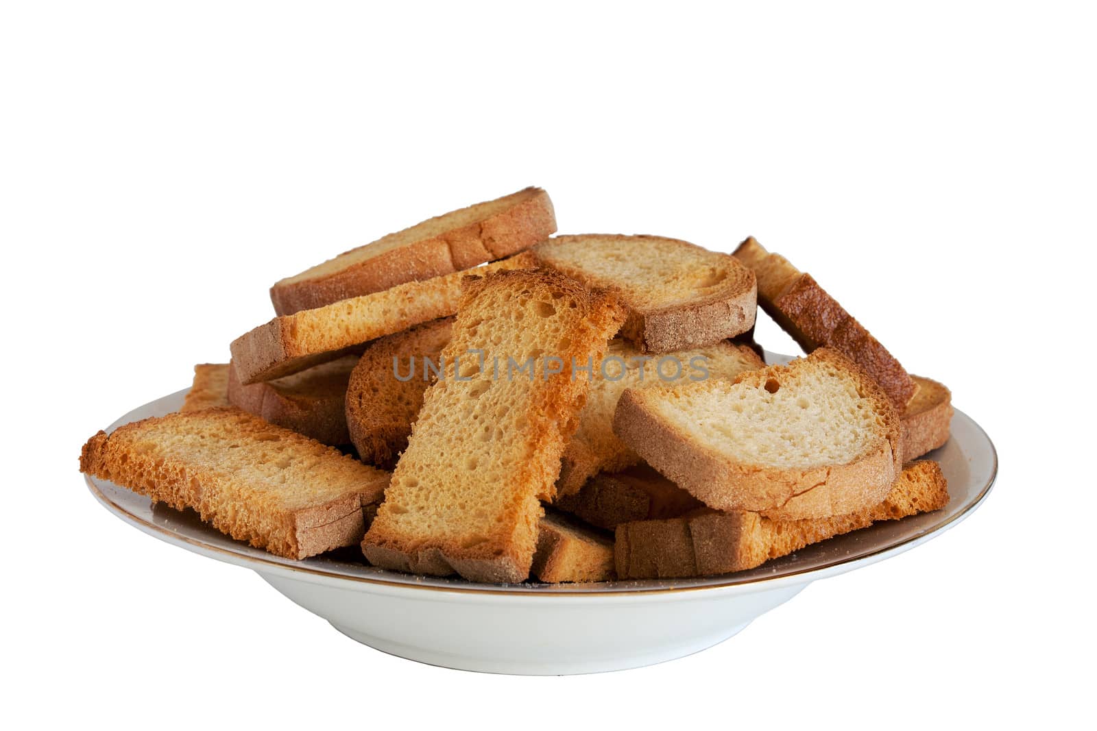 freshly made croutons on a plate isolated on white background