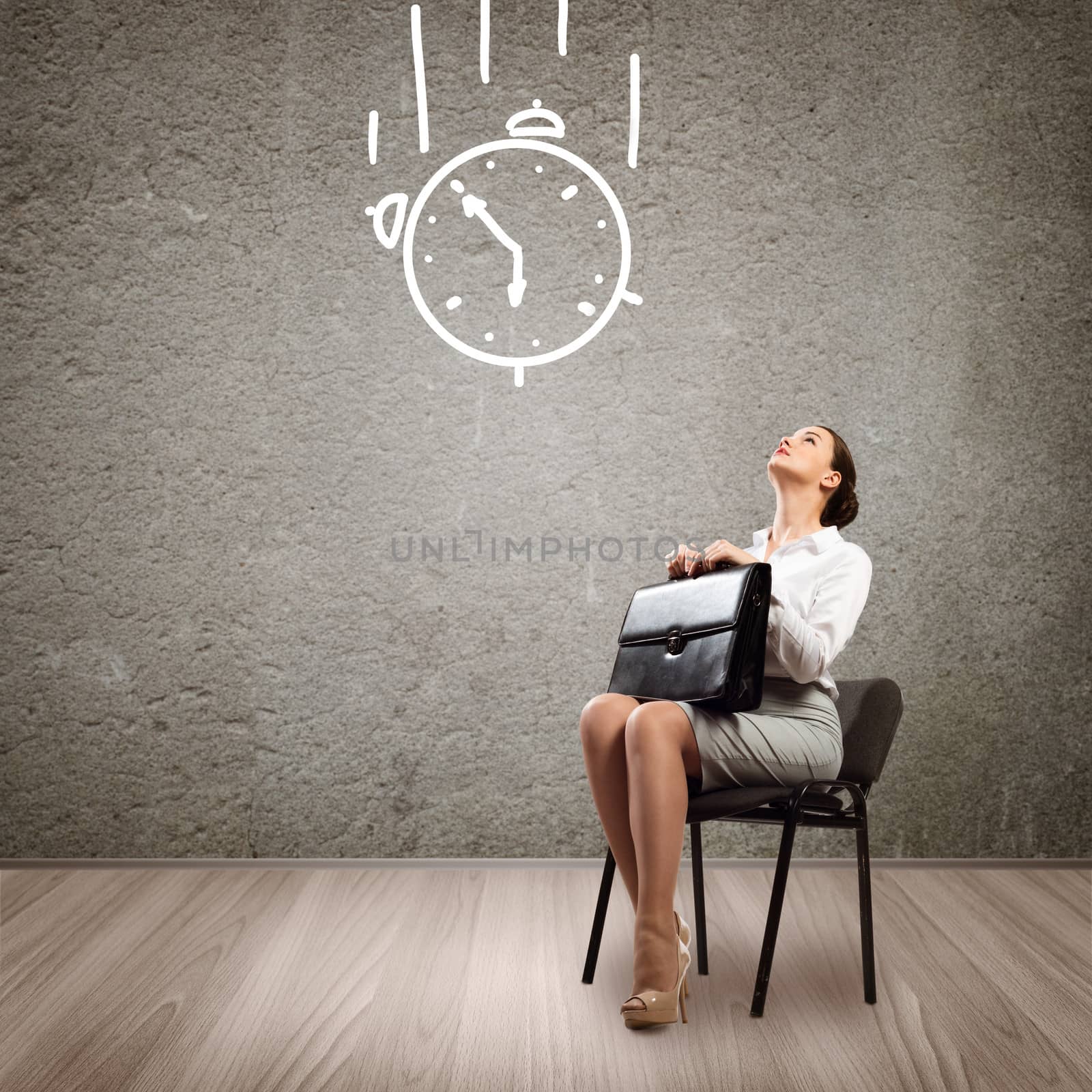 image of a young business woman looking at the sketched clock