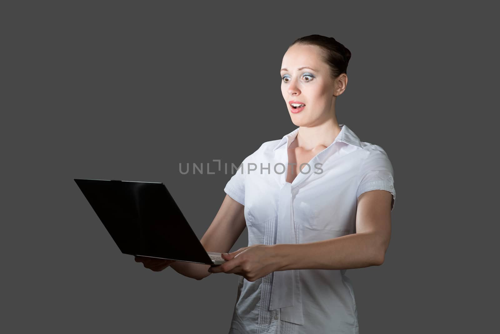 image of young business woman holding laptop