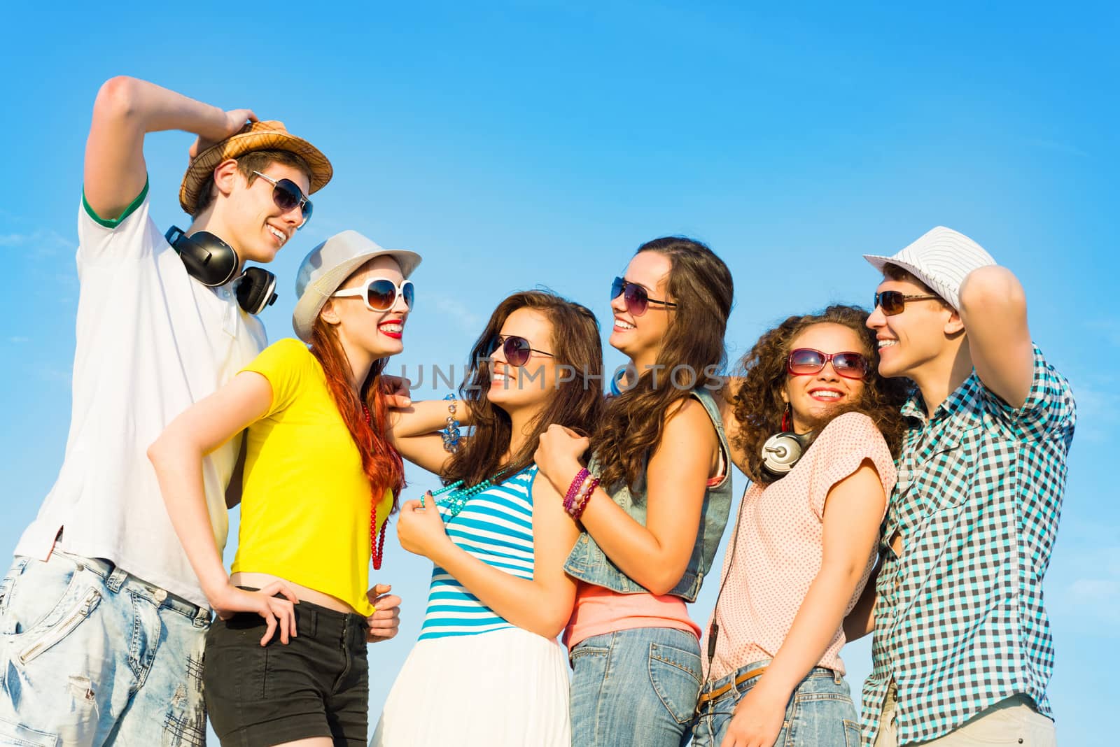group of young people wearing sunglasses and hat by adam121