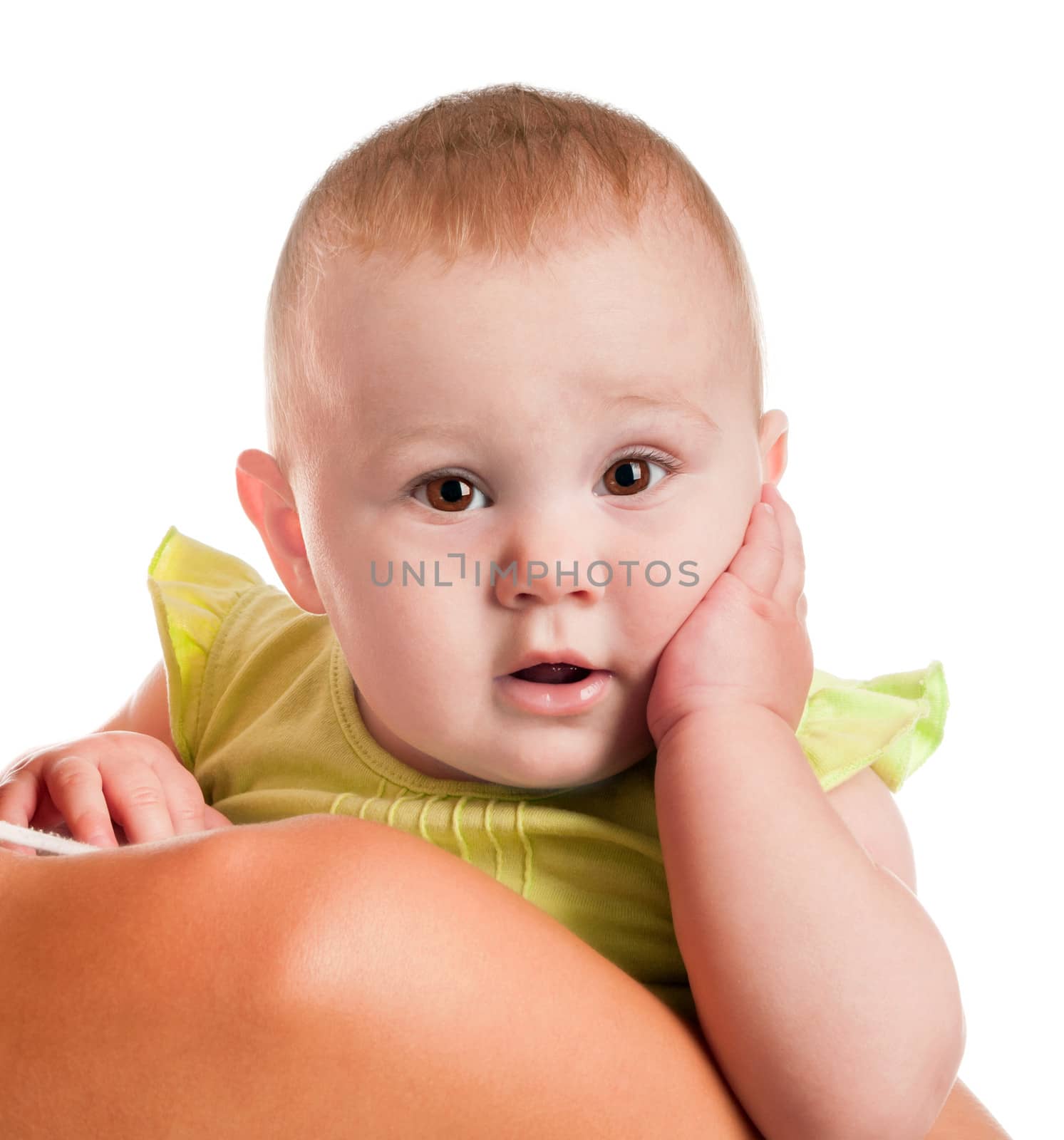baby in mothers arm looking with surprise. Isolated on white