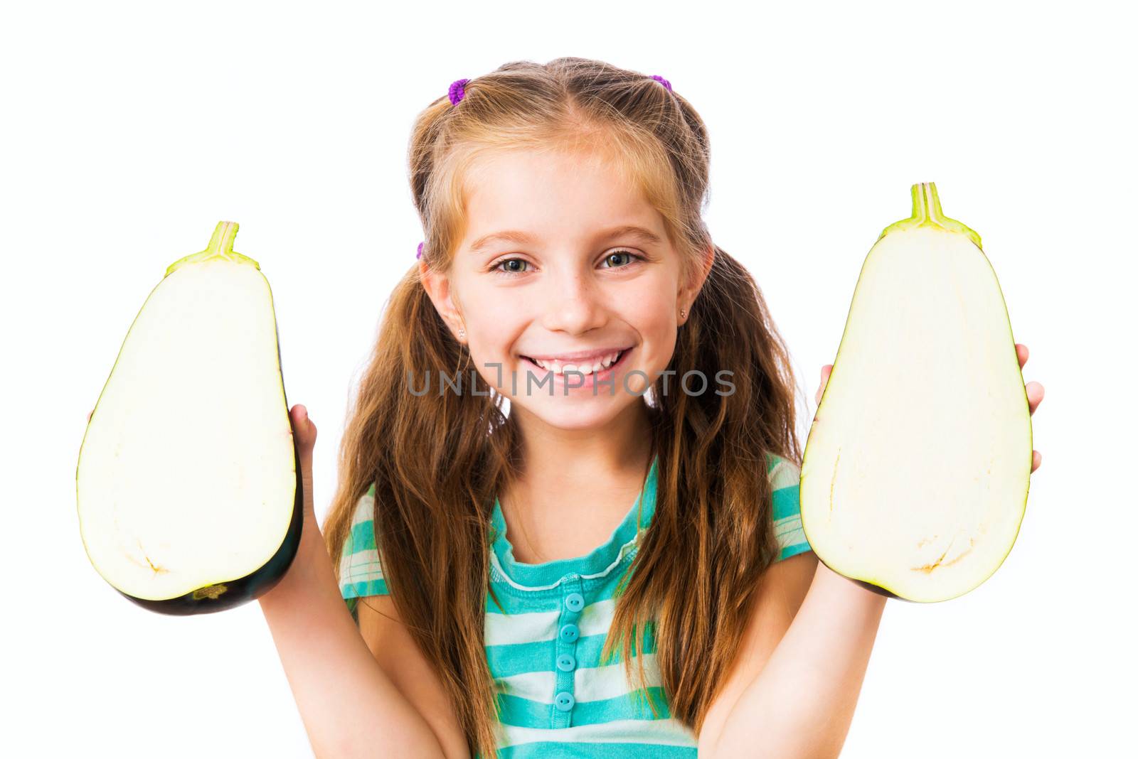 little girl with eggplant halves on a white background